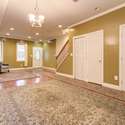 Dining Room to the front. Doors to deep hall closet and half bath.