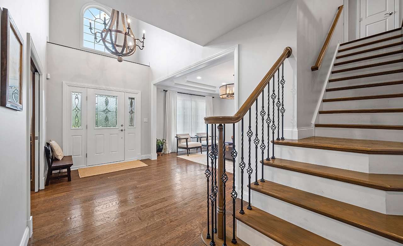 8 of 69. The luxury and quality of the home is evident as soon as you enter the spacious foyer.