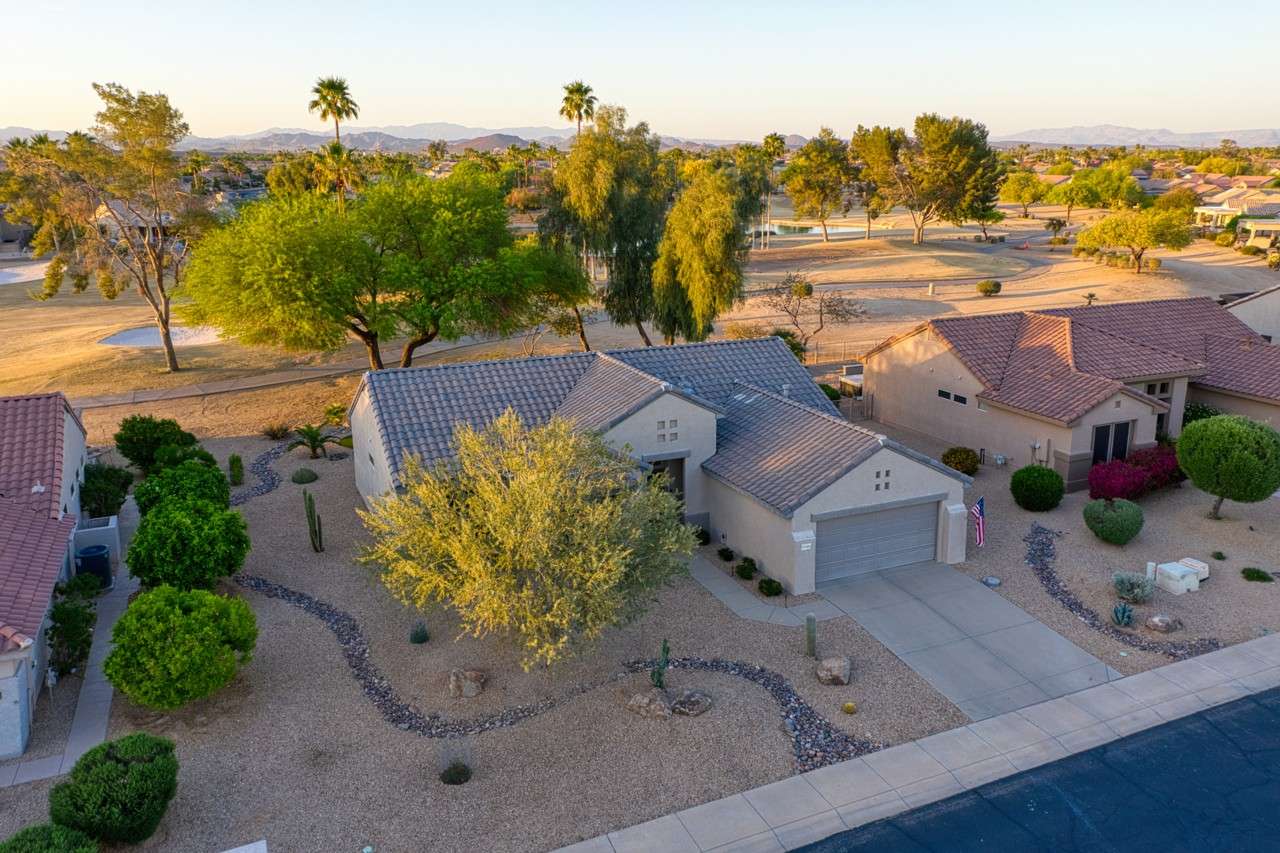 31 of 35. Nestled along the golf course in Surprise, this updated home boasts manicured desert landscaping and mature trees. Enjoy the peaceful ambiance and scenic views from this beautifully positioned lot.