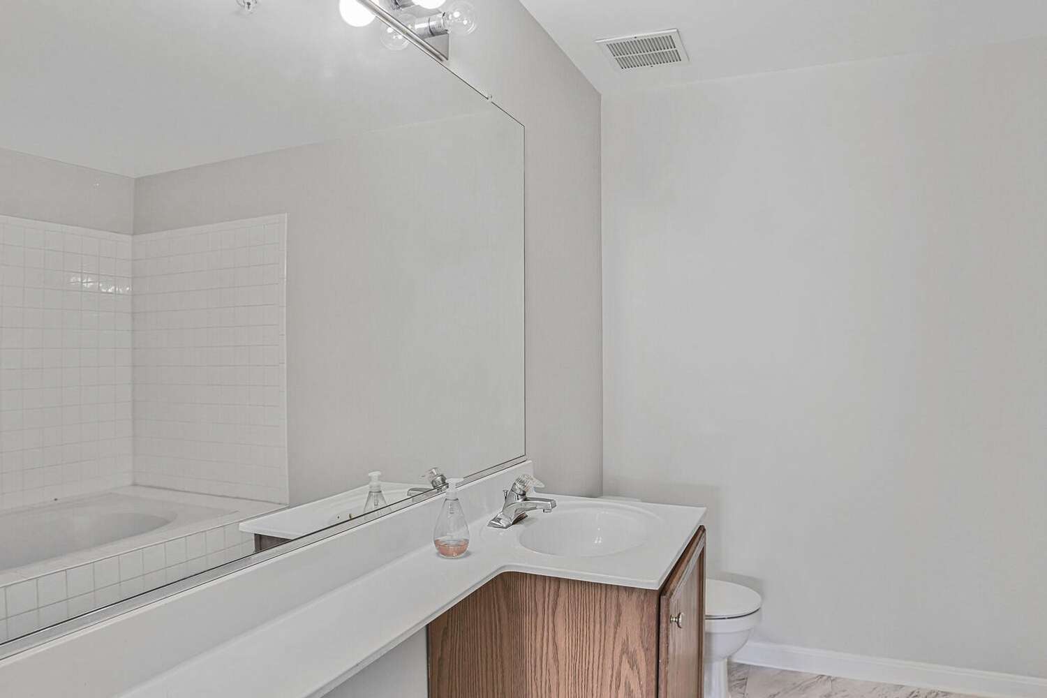 23 of 34. Hall Bath with shower tub combo.
