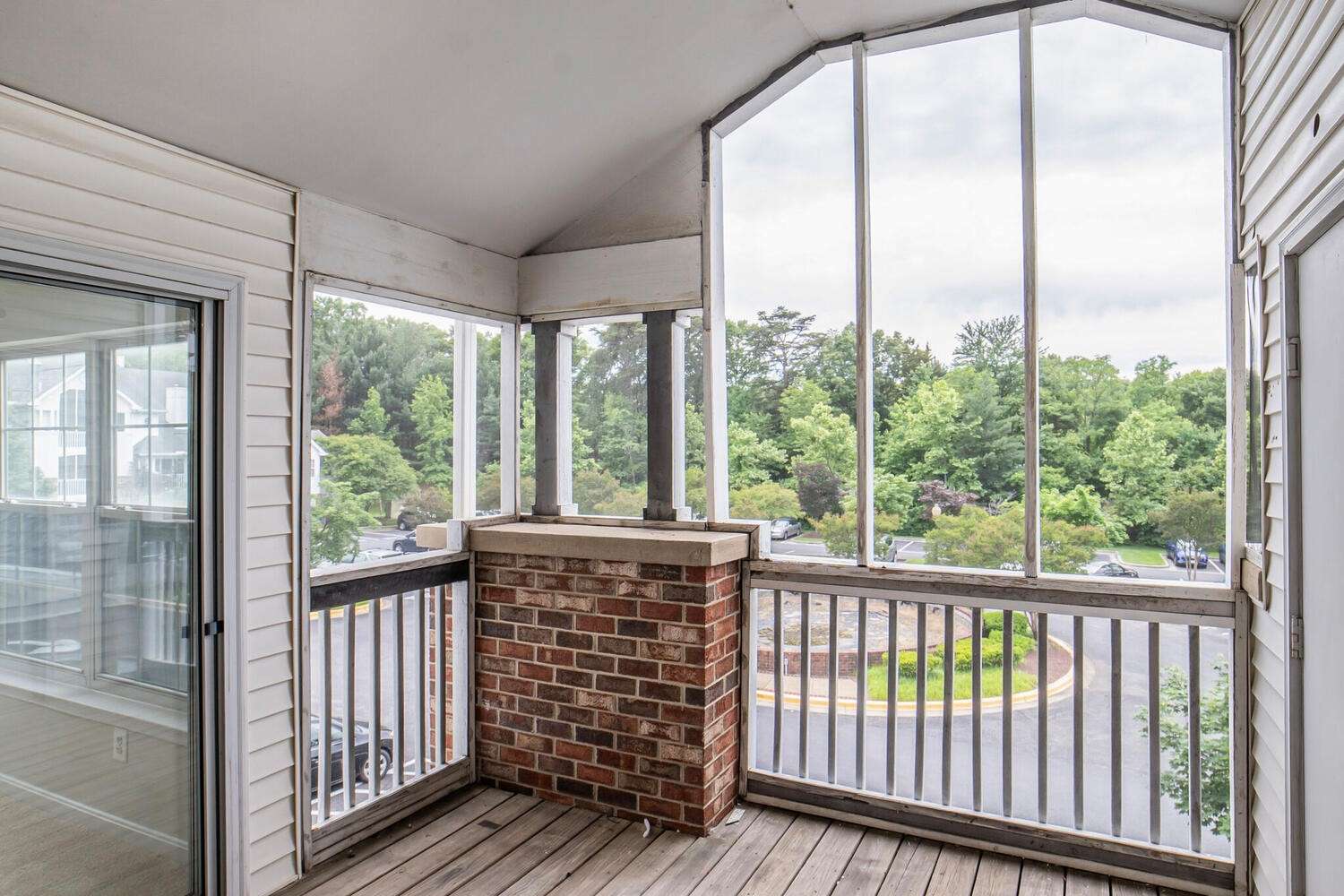 9 of 34. Screened-in Porch view into the Sunroom.