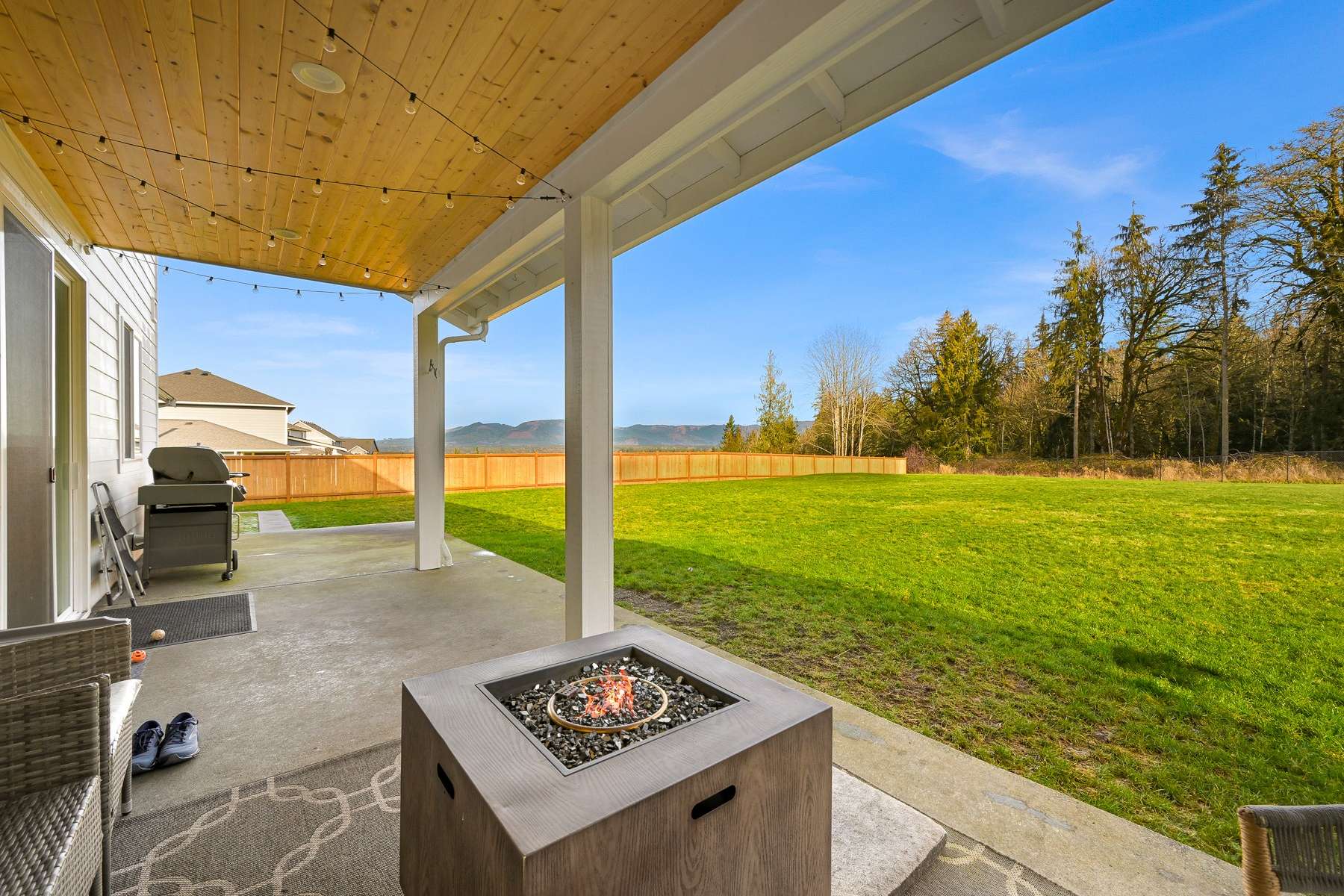 6 of 58. Backyard covered patio overlooking the Cascade Mountains