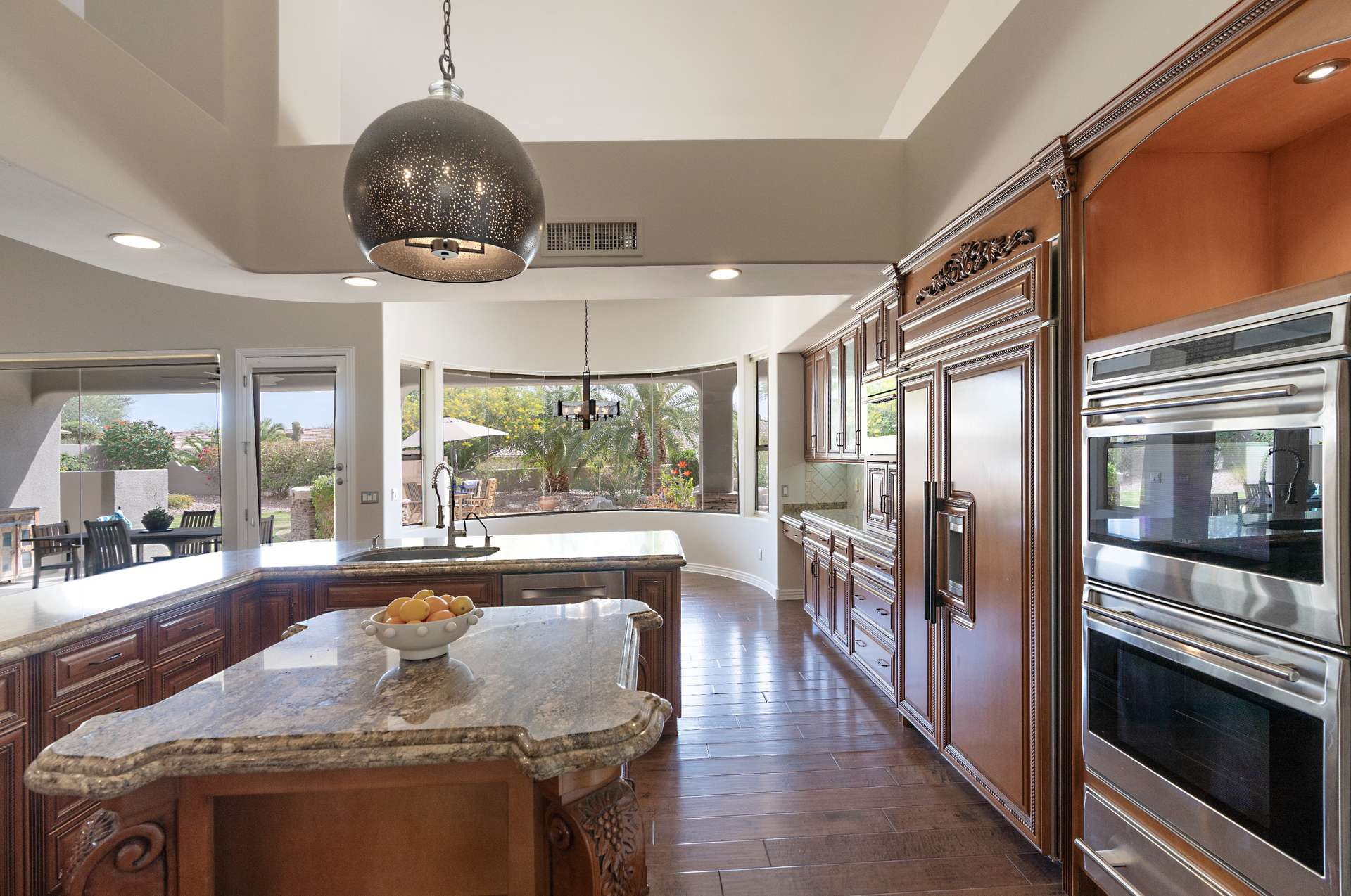 9 of 65. This kitchen impresses with rich custom cabinetry, granite counters, double wall ovens, and built-in refrigerator. Whether hosting or meal prepping, it s built for ease and luxury in every detail.
