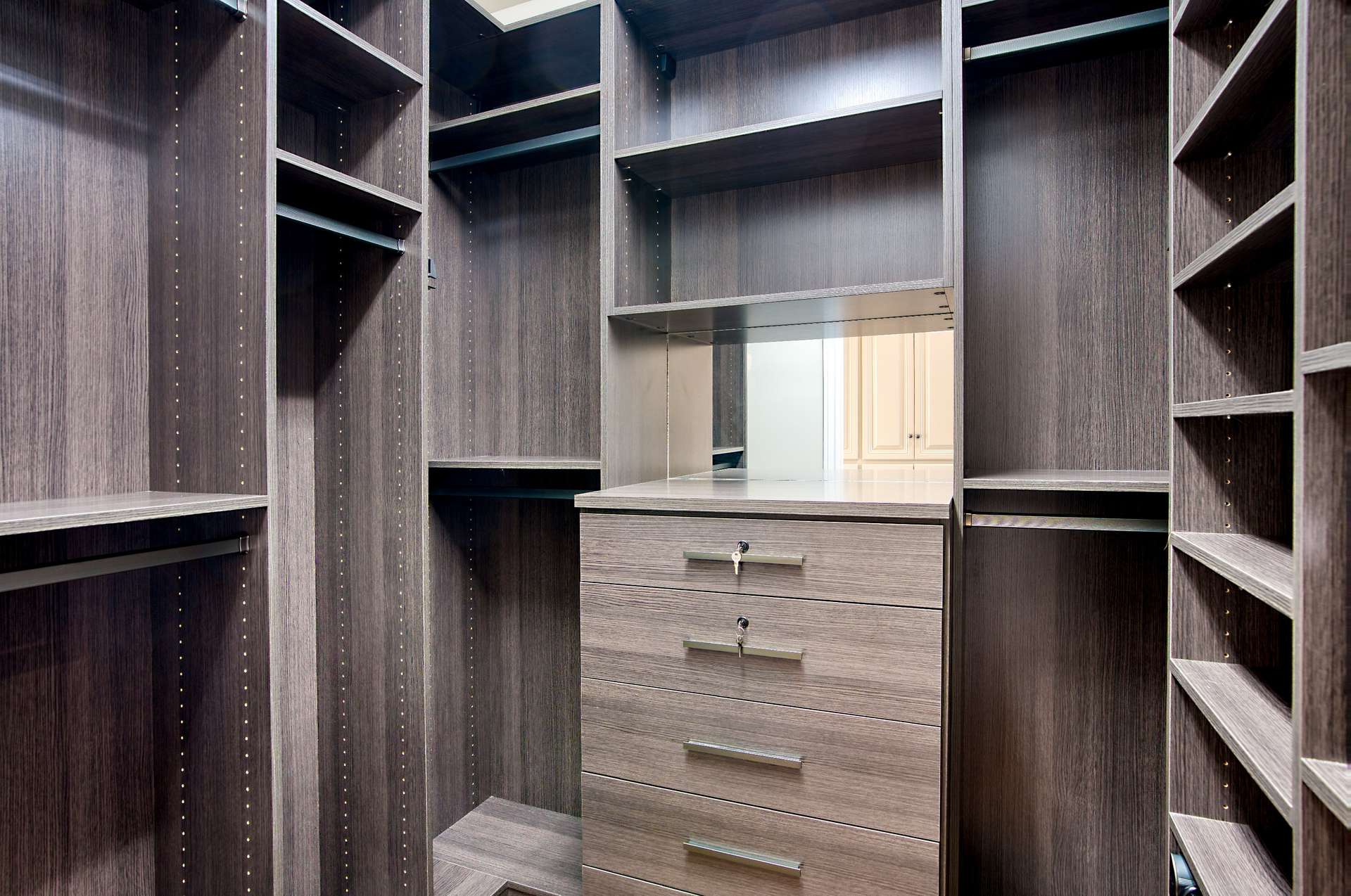19 of 65. Enjoy two thoughtfully designed walk-in closets with custom cabinetry and modern finishes. Plenty of room for his-and-hers storage in this luxurious Scottsdale master suite.
