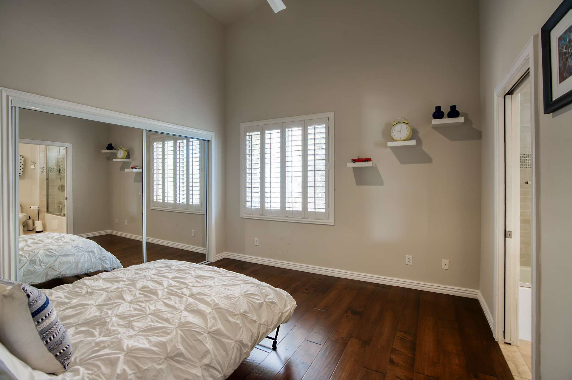22 of 65. This dual-purpose guest room offers a Murphy bed, built-in California Closets workstation, and natural light perfect for remote work or weekend visitors.