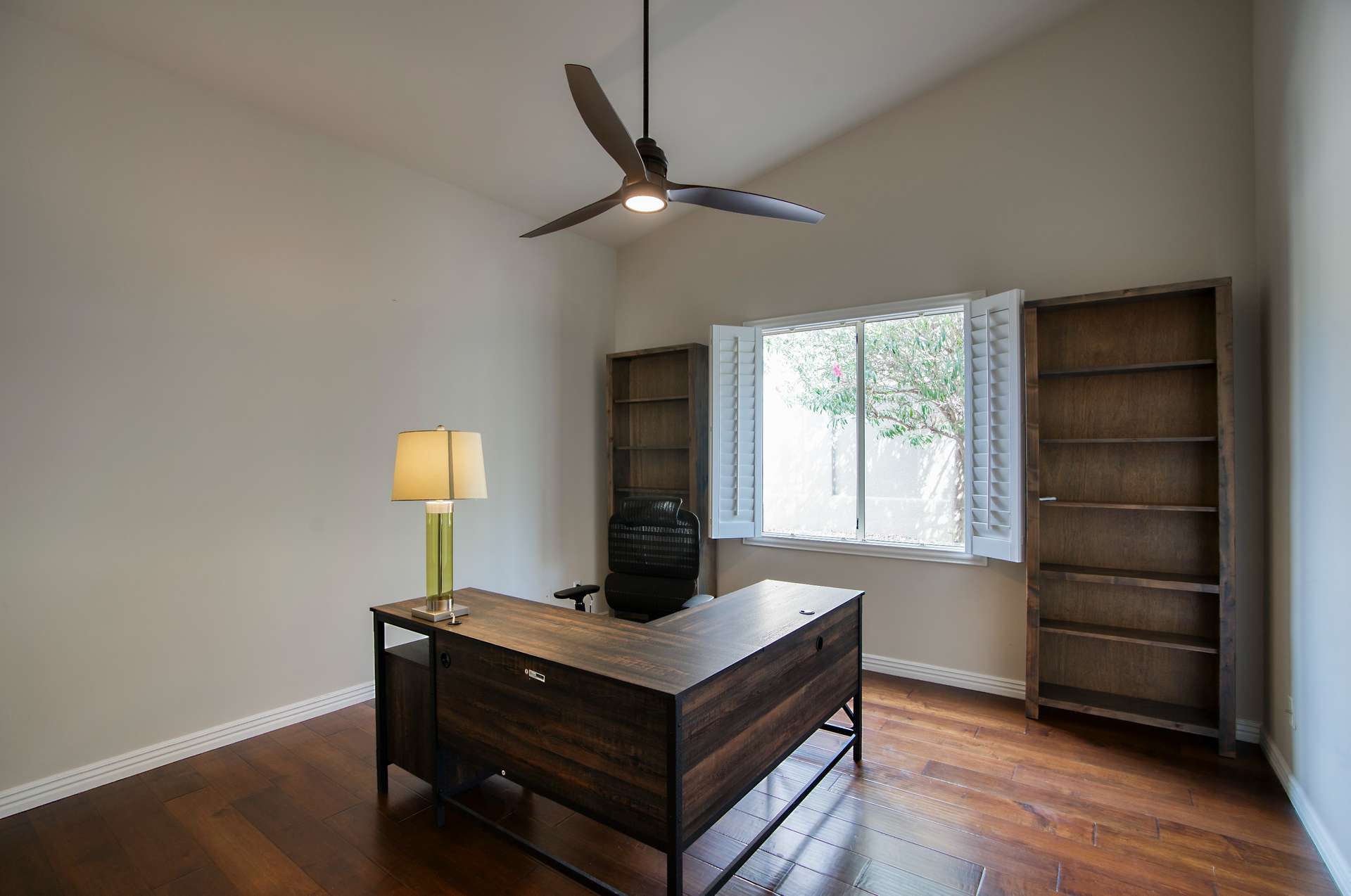 23 of 65. A private, flexible space with hardwood floors, ceiling fan, and tranquil backyard views ready to be your home office, library, or extra bedroom.
