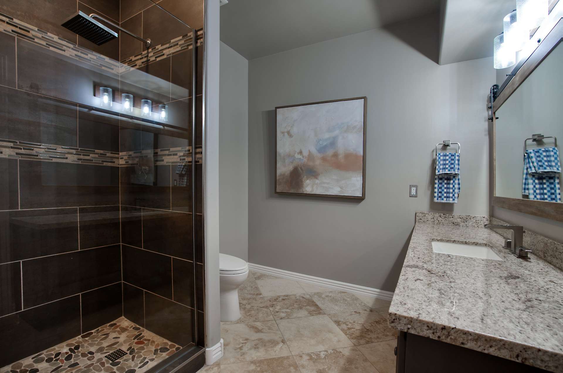 25 of 65. With rich tilework, walk-in glass shower, granite vanity, and soft lighting, this renovated guest bath feels like a private spa in the heart of Scottsdale.