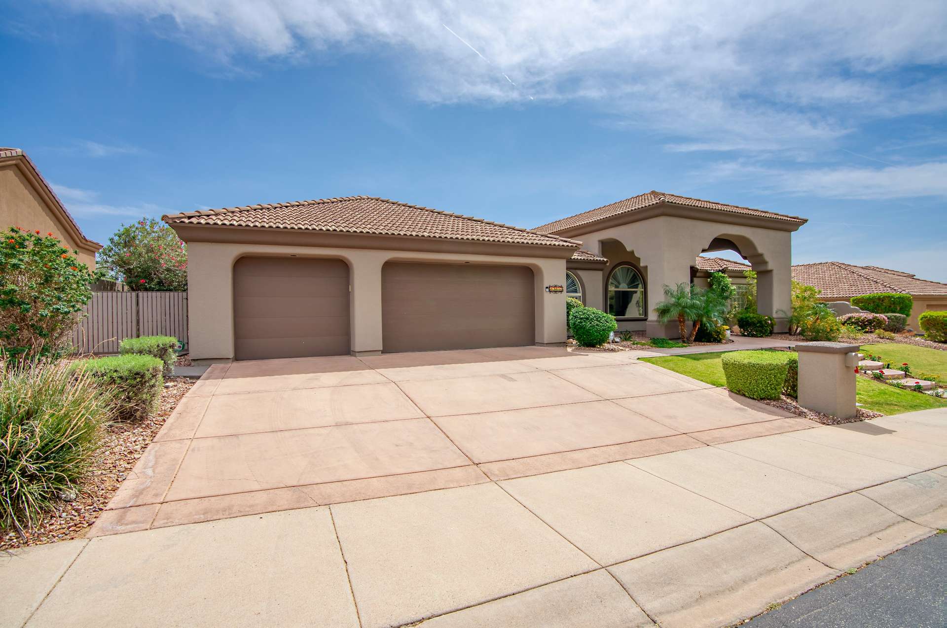 55 of 65. This well-maintained home includes a three-car garage and expansive driveway perfect for multiple vehicles, storage, or recreational gear. The low-maintenance landscaping and clean exterior enhance its overall appeal in a sought-after neighborhood.