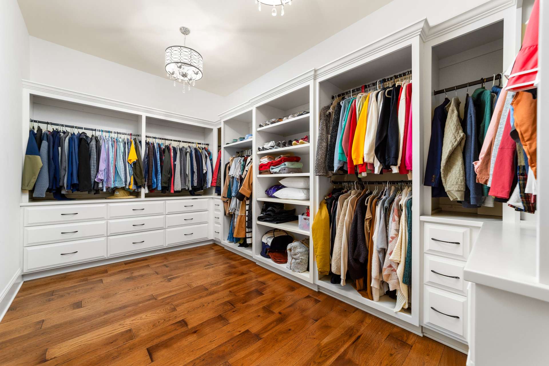 33 of 79. Interior Photo - 846 Armstrong Rd - Additional Photo of Primary Closet showcasing extensive custom closet cabinetry and organization.