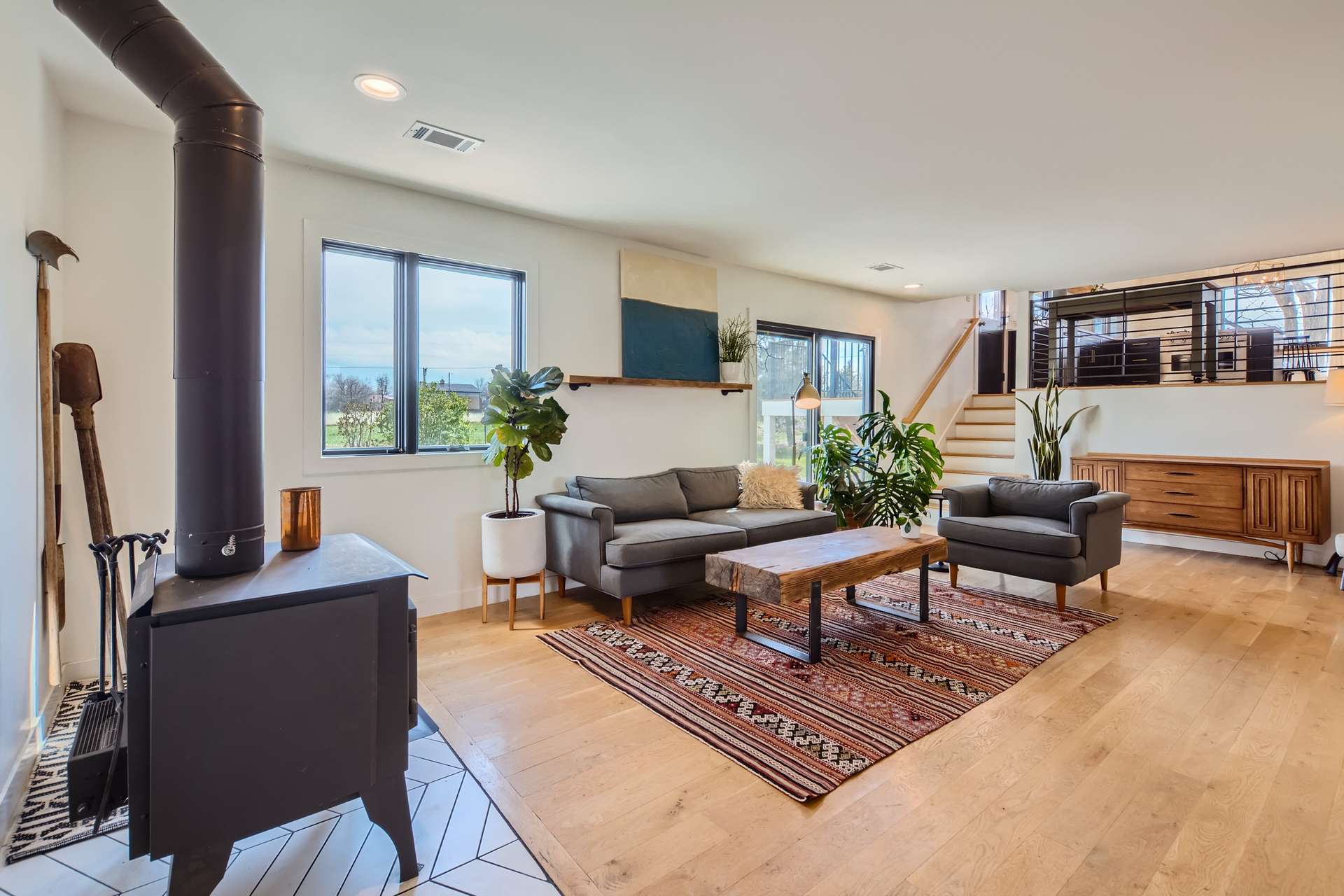 12 of 31. Walkout Lower Level Family Room with Wood Stove