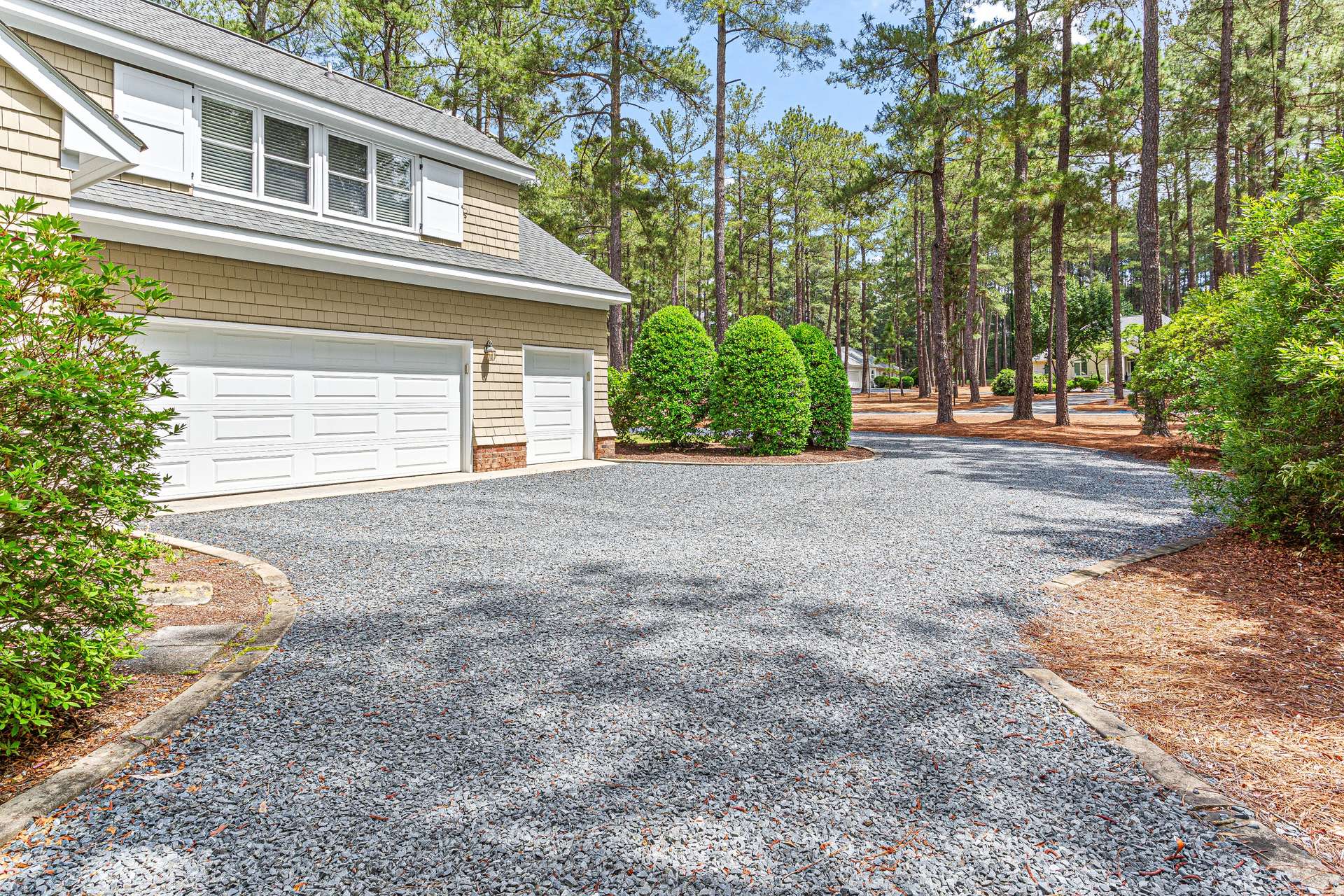8 of 66. 2-car garage with golf cart garage, walk-in storage and utility sink.