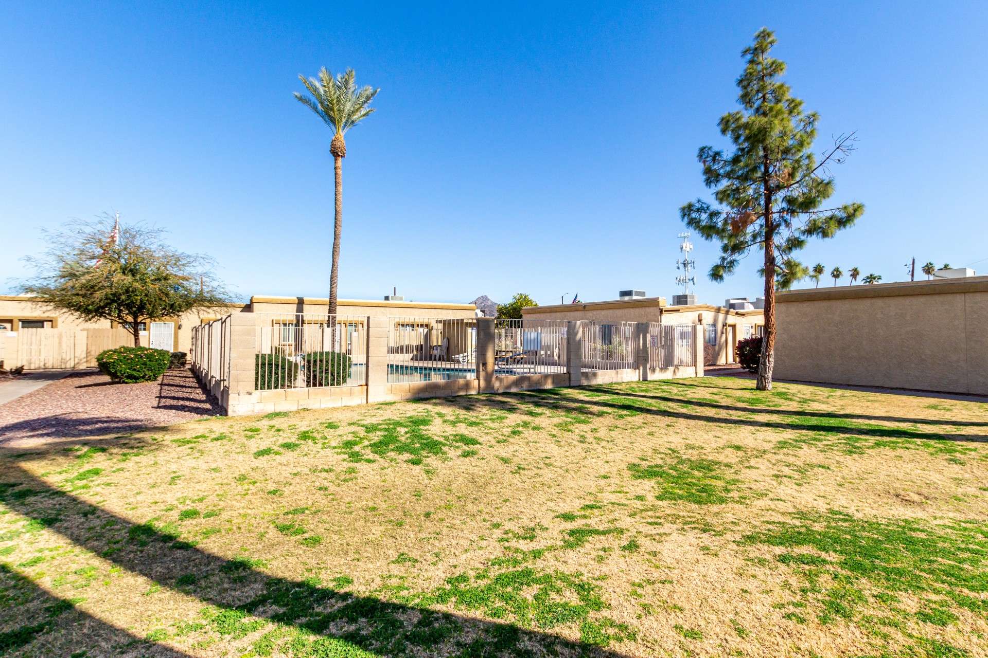 23 of 26. Step outside and enjoy lush green surroundings with easy access to the gated community pool. A well-maintained lawn provides a great space for relaxing outdoors, morning walks, or enjoying Arizona s beautiful weather.