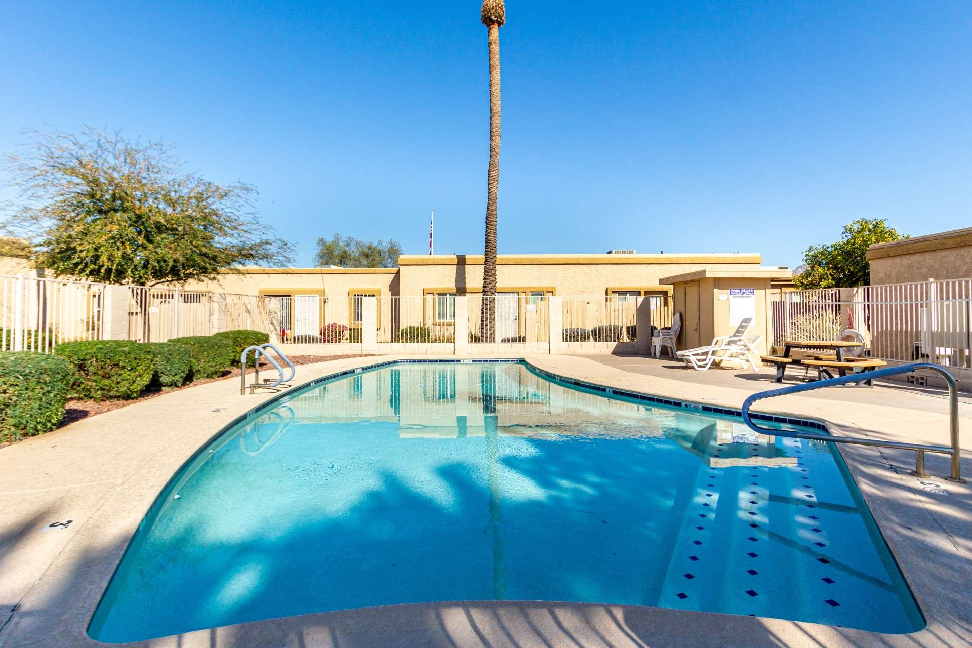 1 of 26. Take advantage of the sparkling community pool, perfect for cooling off in the summer or unwinding poolside. With ample lounge seating and a secure gated entry, this space is designed for relaxation and socializing.