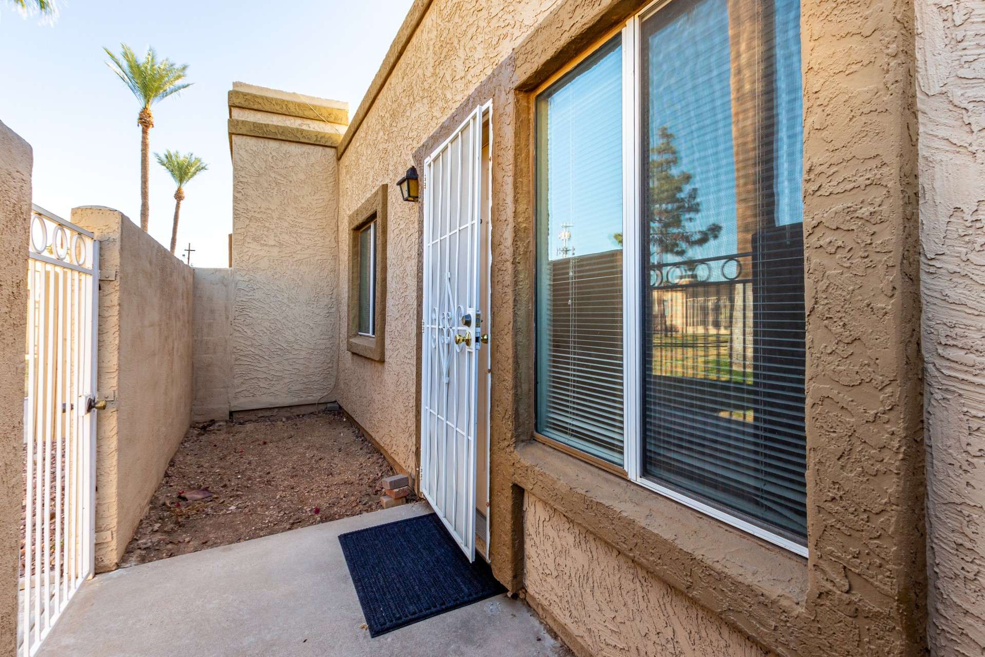 3 of 26. This private, enclosed patio provides a welcoming entryway and added outdoor space. Perfect for a pet-friendly home or a personal garden, this space enhances the home s security and curb appeal while offering a peaceful retreat in the heart of Phoenix.