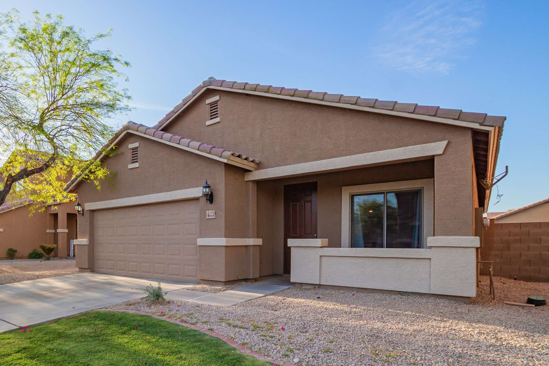 33 of 37. Relax on the covered front patio, ideal for sipping coffee or catching up with neighbors. This added outdoor space enhances everyday living and brings a touch of community charm.