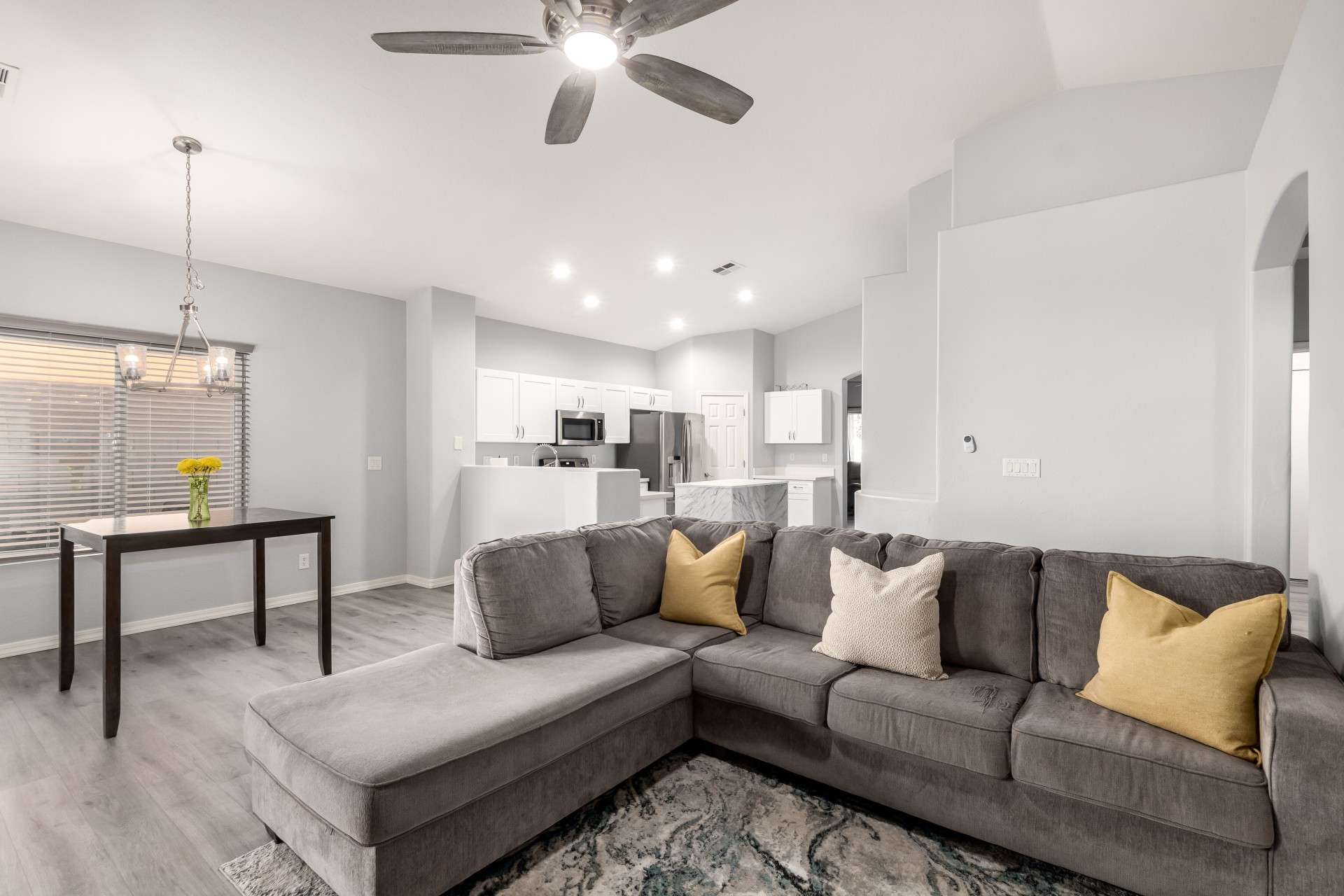11 of 37. Enjoy open-concept living with this expansive family room that connects directly to the kitchen and dining area. Updated flooring, fresh paint, and LED recessed lighting make this a warm and energy-efficient space for any lifestyle.