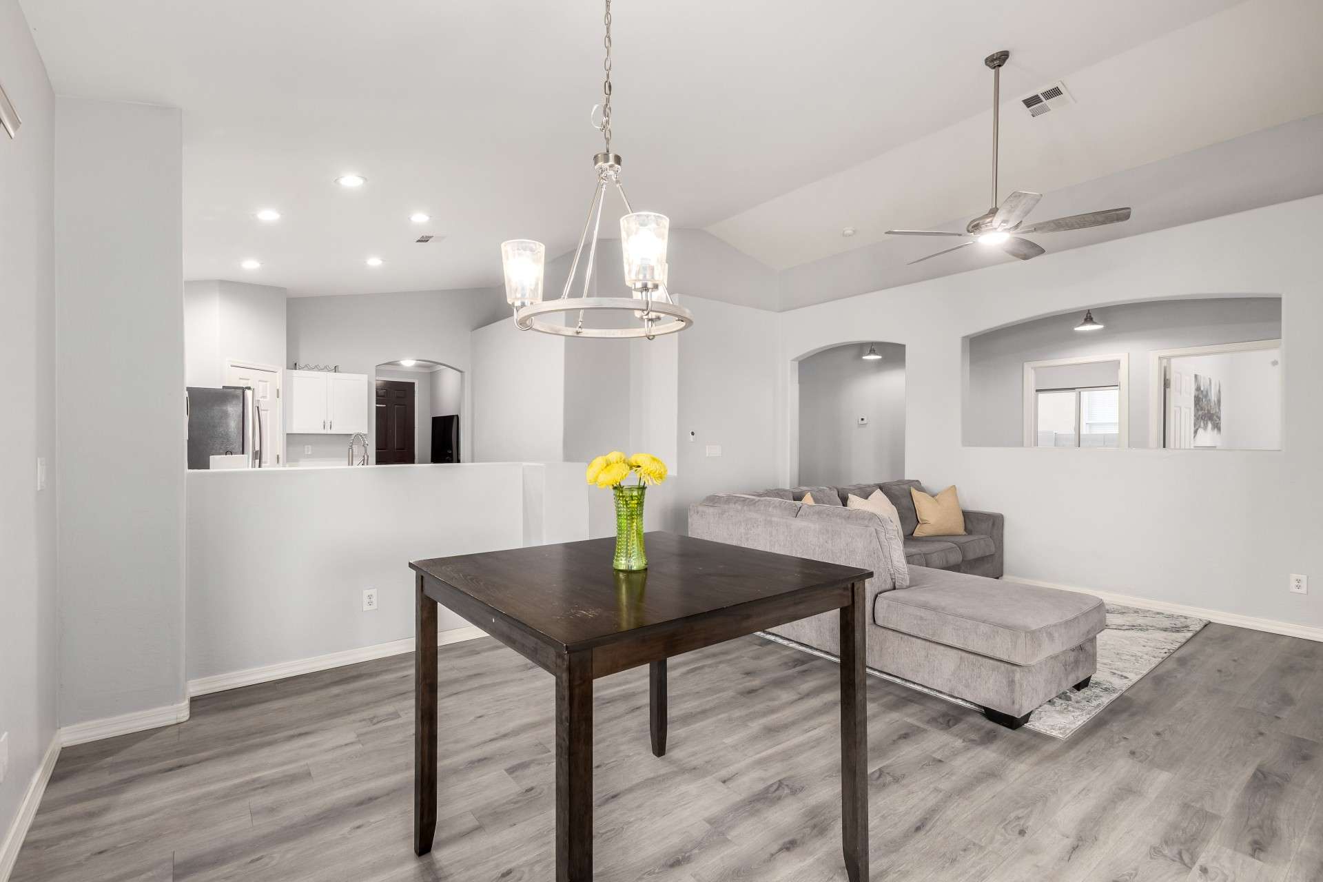 12 of 37. This central dining area anchors the kitchen and living room with style and simplicity. Featuring modern lighting, luxury vinyl flooring, and flexible design, it's ideal for entertaining or everyday meals.
