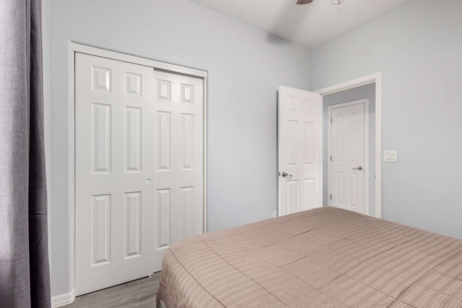 21 of 37. This secondary bedroom includes a unique wooden sliding door leading to the adjacent home office. It's a perfect multi-use space, blending comfort with connectivity for today s lifestyle.