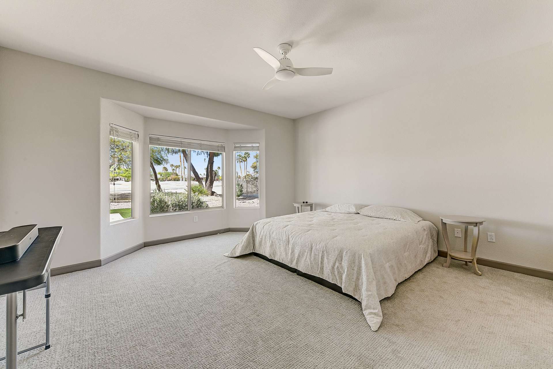 13 of 35. Wake up to peaceful golf course views in this spacious and serene primary suite. Plush carpet, a soft color palette, and oversized windows create a quiet, light-filled retreat at the heart of the home.
