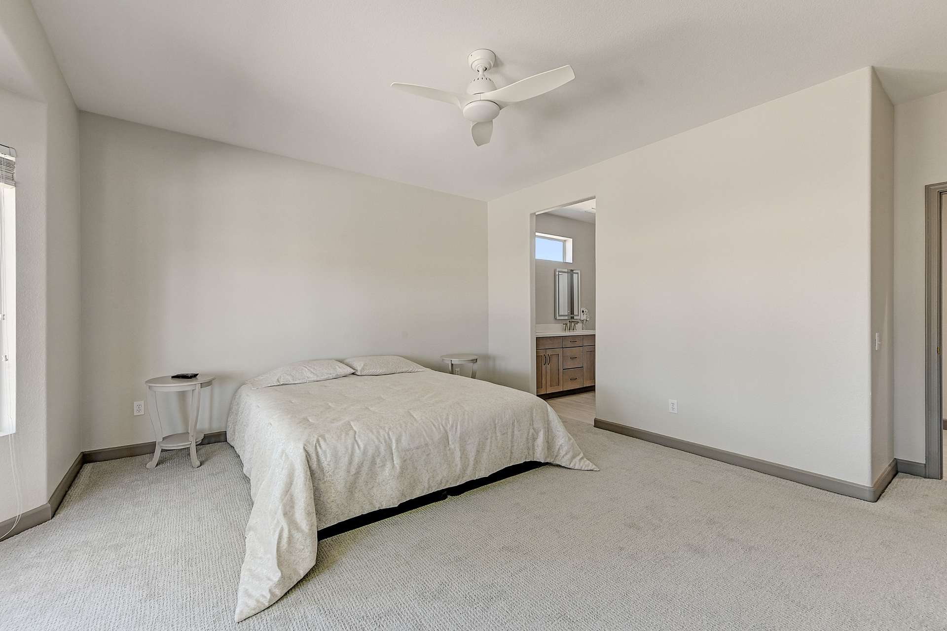 14 of 35. This owner s suite offers comfort, privacy, and a clean, modern design. Direct access to the spa-like ensuite bath makes this space ideal for unwinding after a day on the course or exploring Surprise.