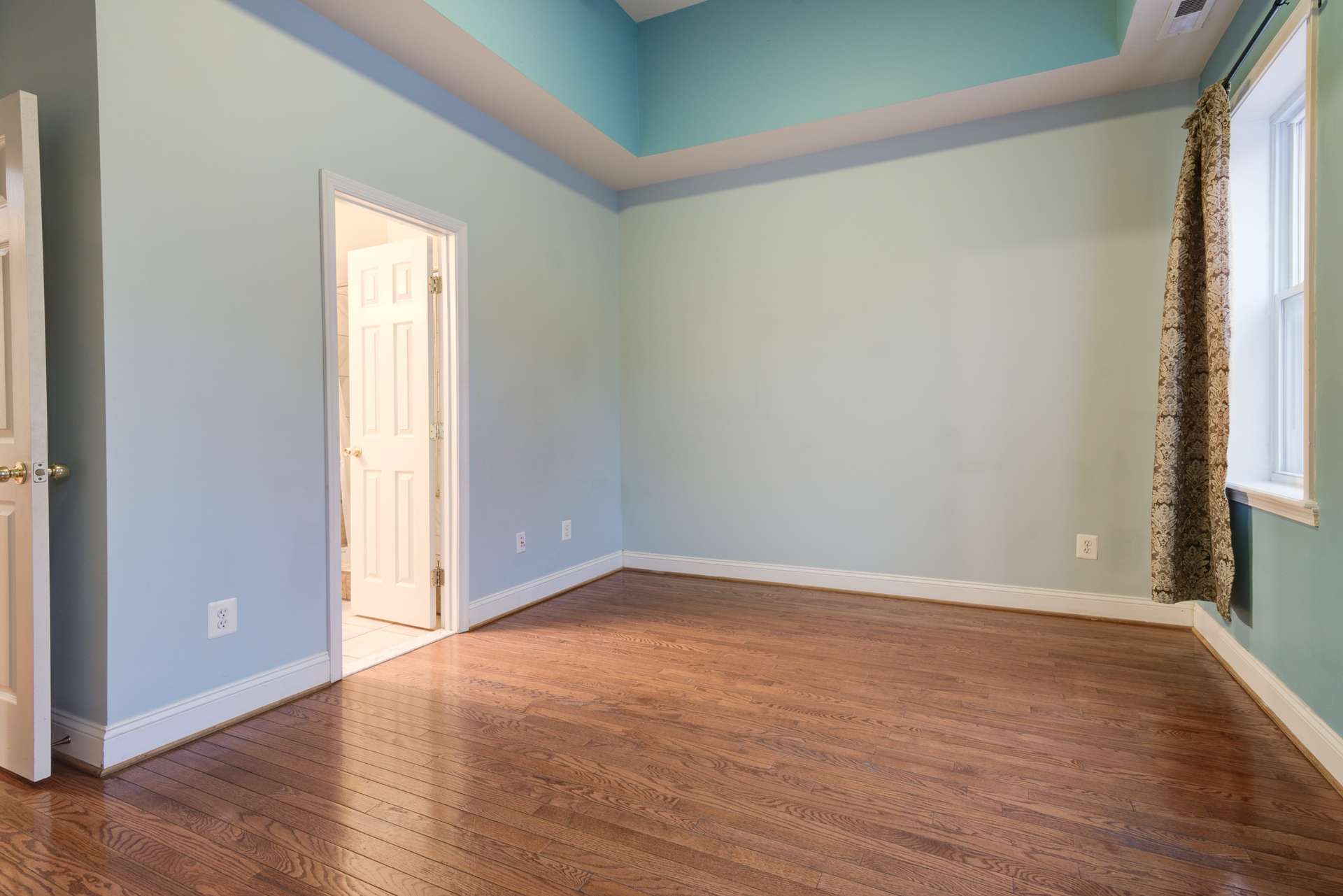17 of 42. Primary Bedroom with vaulted ceilings.