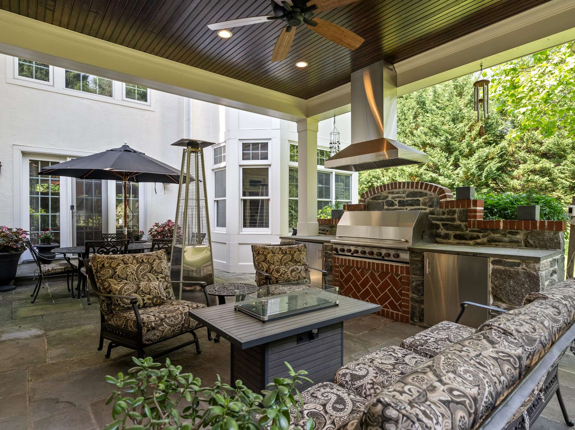 58 of 66. Covered Flagstone Terrace w/ Outdoor Kitchen