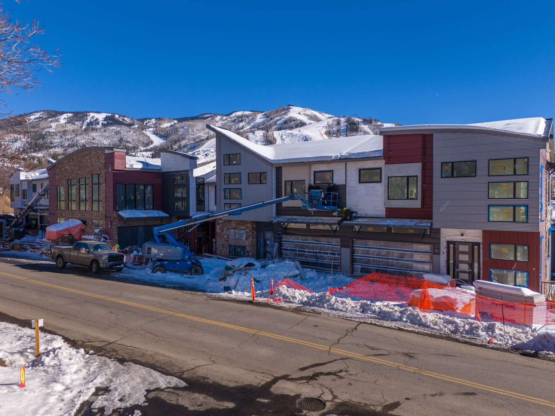 5 of 27. View of front facade with a mountain view