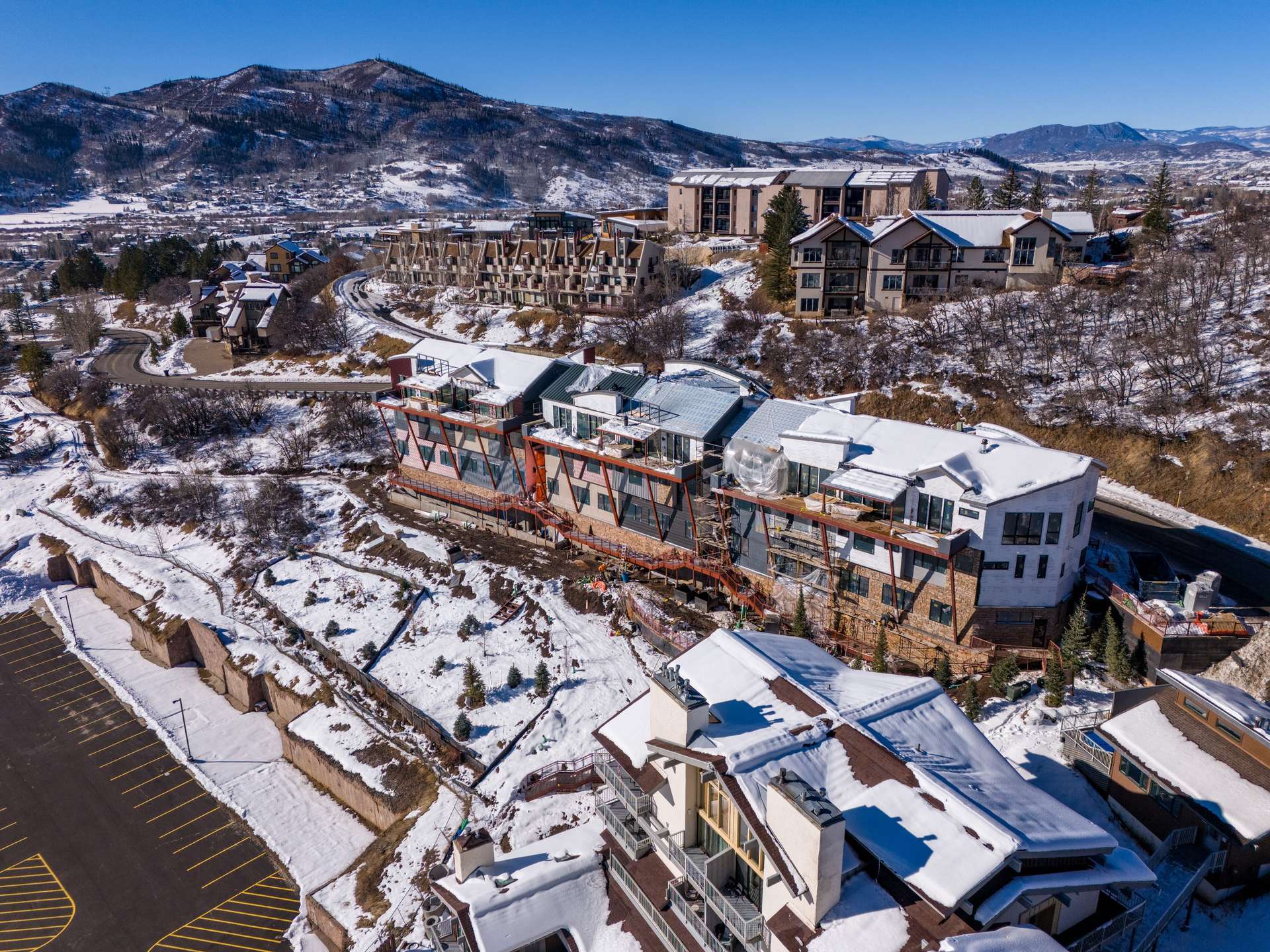 12 of 27. Snowy aerial view featuring a mountain view