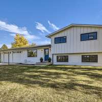 Welcome to this stunning Niwot home that has been meticulously updated with a modern farmhouse style. Situated on nearly an acre of land, this property offers a peaceful and serene setting.