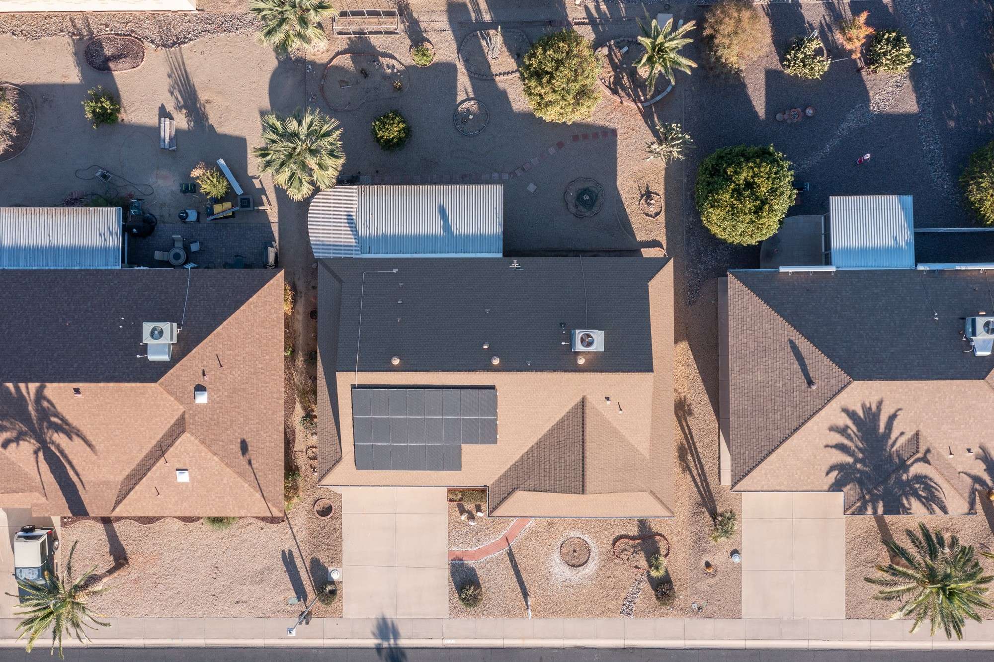 10 of 48. A unique aerial shot showing spacious lots and a well-designed community. This view emphasizes privacy and the peaceful desert lifestyle offered in Sun City West.