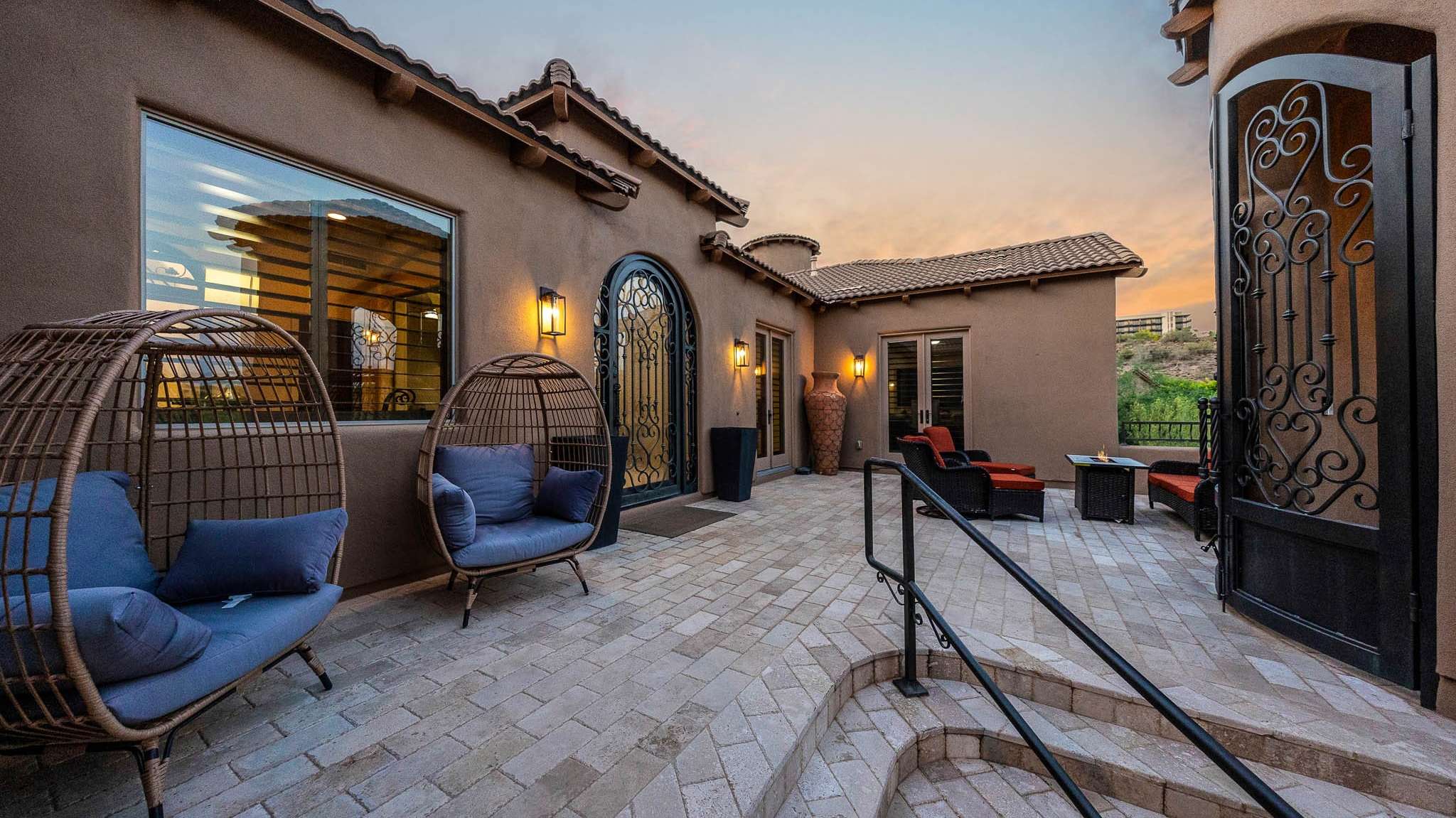 3 of 39. This inviting courtyard offers privacy and charm with paver stone flooring, designer lighting, and relaxing outdoor seating. A peaceful Scottsdale space perfect for coffee mornings or evening cocktails.