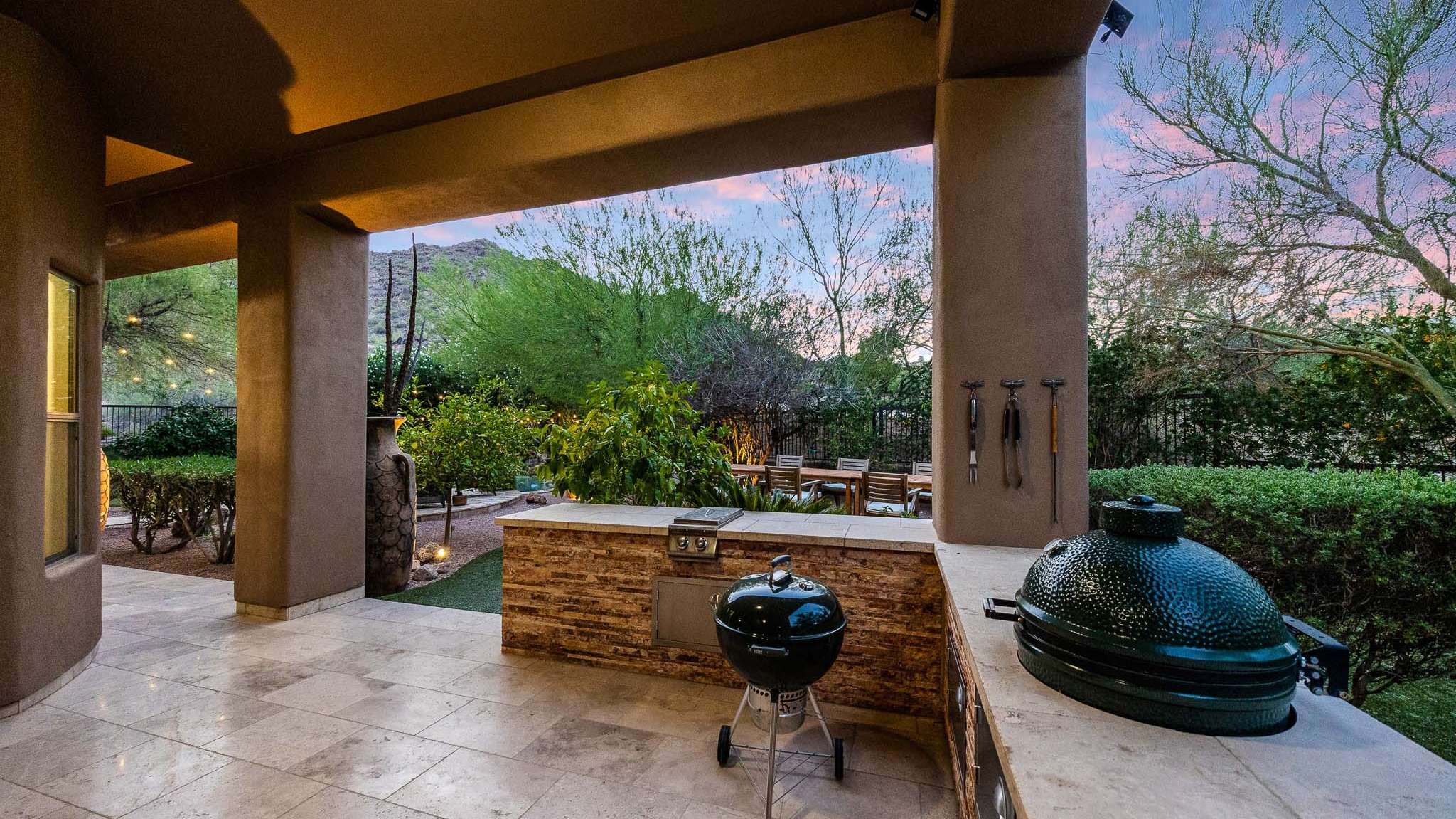 22 of 39. This covered patio is equipped with a built-in BBQ island, dual grills, and prep space ideal for hosting gatherings in the heart of Scottsdale s outdoor lifestyle.