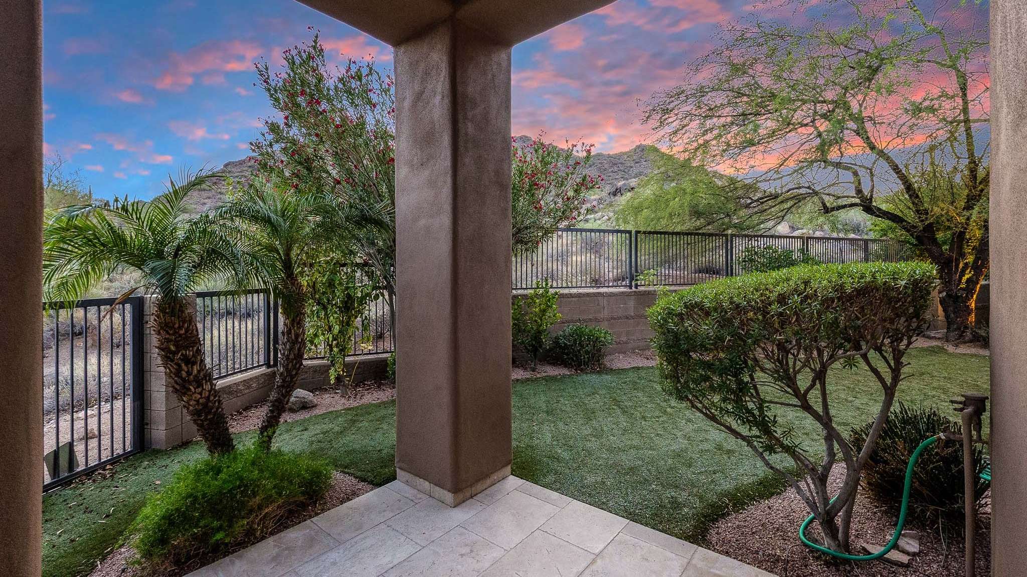 23 of 39. Framed by vibrant desert plants and low-maintenance turf, this backyard sitting area opens to tranquil mountain views an inviting spot for relaxation in Scottsdale s natural beauty.