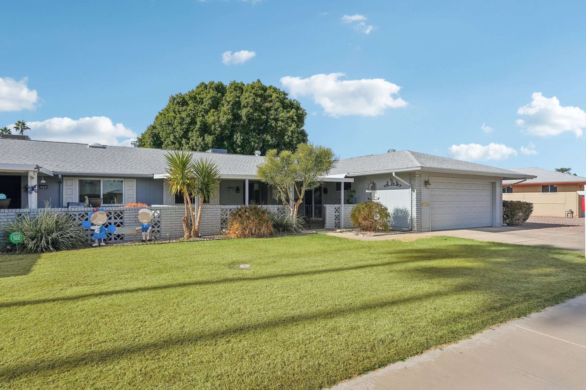 2 of 41. Featuring a picturesque front yard, mature trees, and a welcoming entryway, this low-maintenance home offers a peaceful setting in a prime Sun City location. Close to recreation centers, shopping, and golf courses.