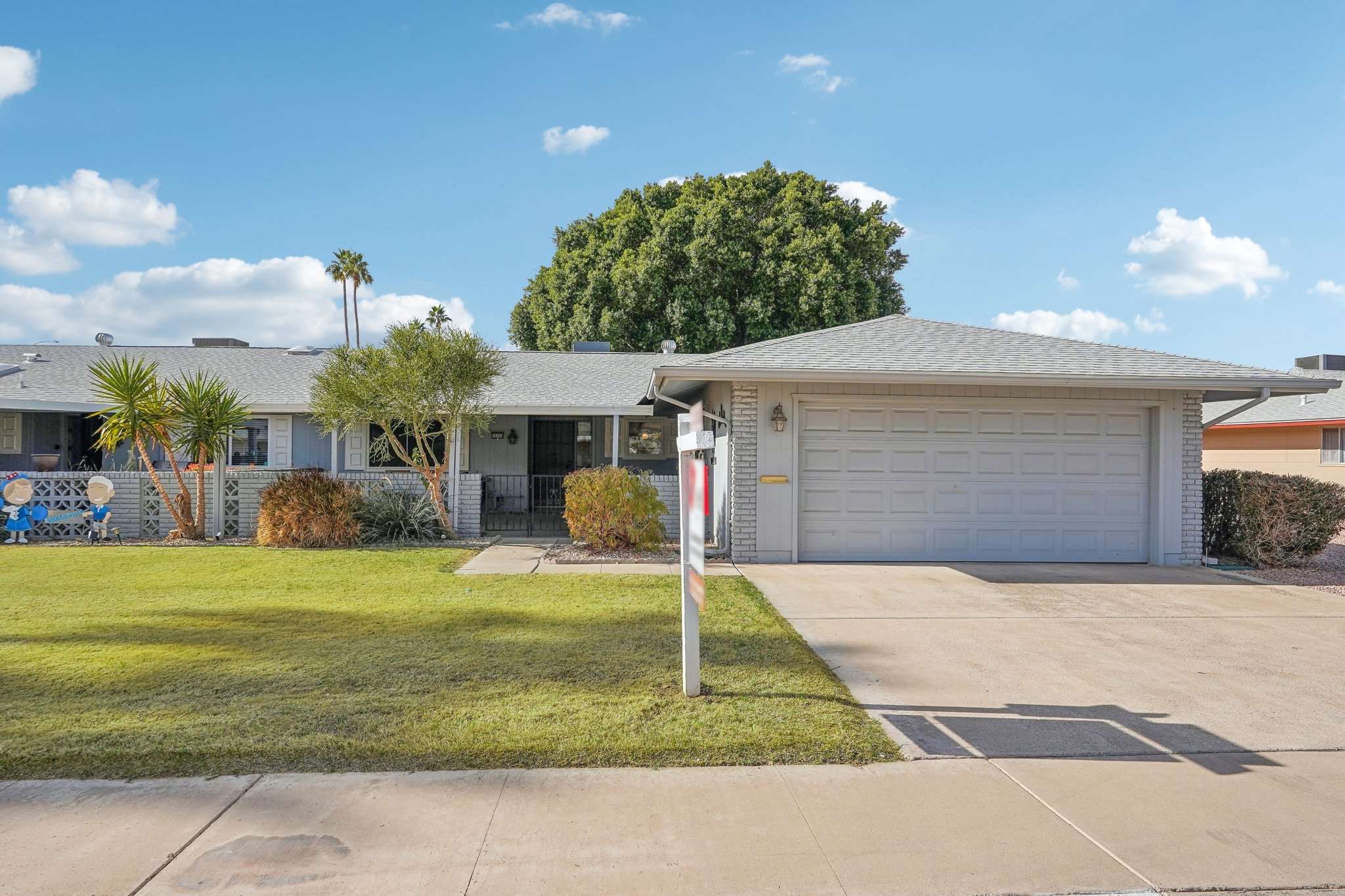 28 of 41. The welcoming front entryway and charming covered patio create a warm and inviting first impression. A beautiful blend of modern updates and timeless Sun City charm.