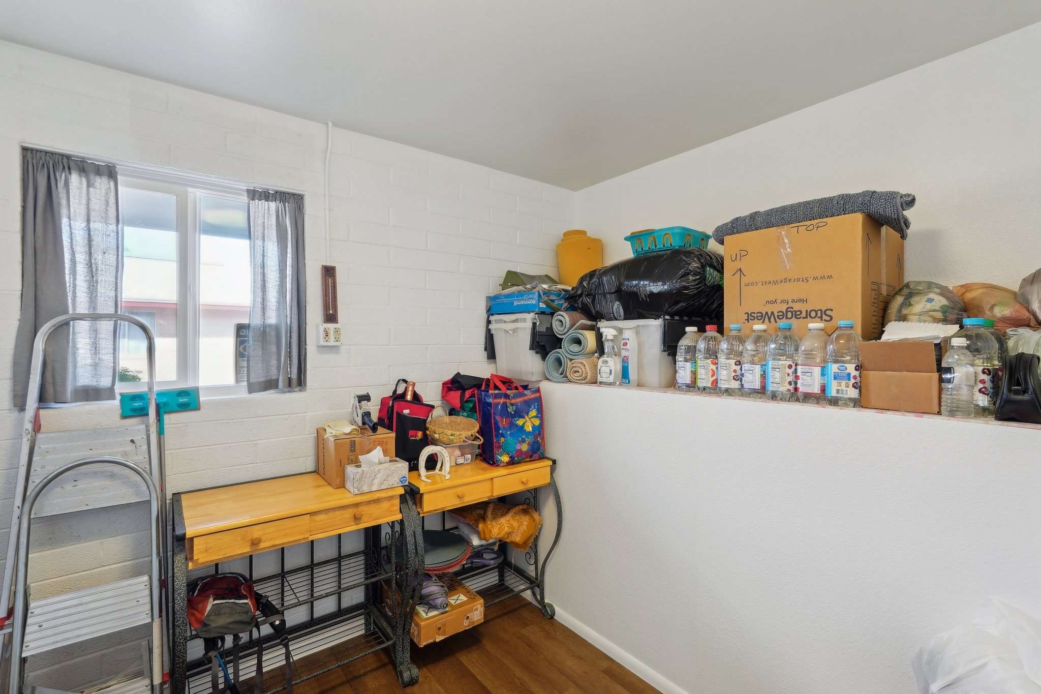 17 of 41. This functional storage room is ideal for seasonal d cor, tools, or extra household items, providing valuable storage space in this well-designed home.