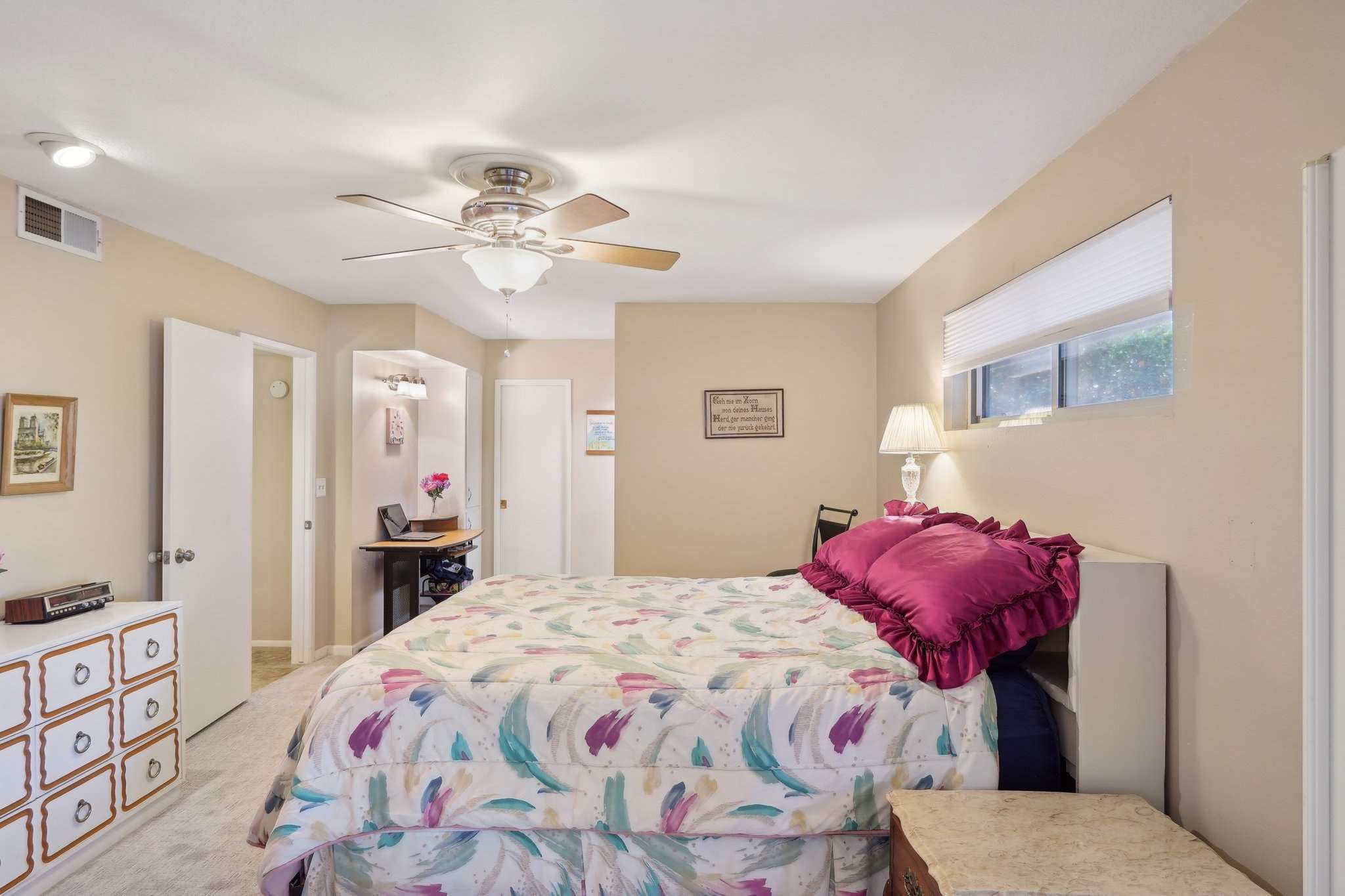 33 of 41. The primary suite offers a spacious layout, private en-suite bathroom, and large windows for natural light. A comfortable and relaxing retreat.