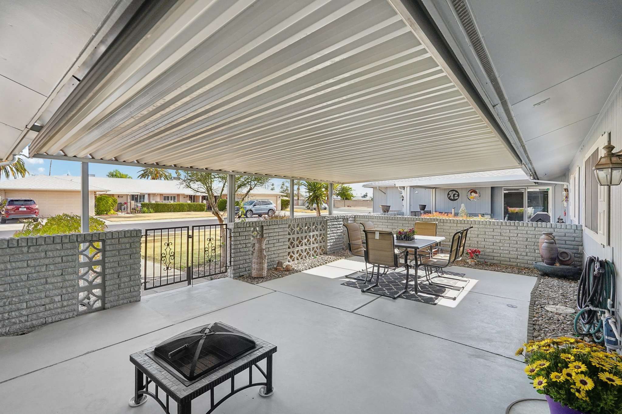 32 of 41. This covered front patio provides ample seating space and a shaded area to relax, perfect for enjoying the neighborhood ambiance and Arizona s mild winters.