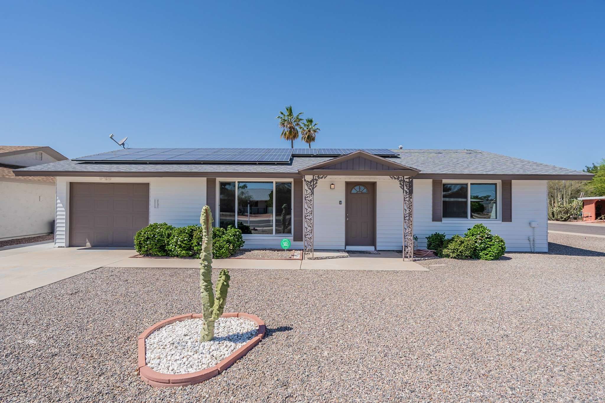 3 of 35. This stylish Sun City home boasts solar panels, fresh exterior paint, and a desert-friendly front yard. Enjoy the benefits of energy efficiency while living in a quiet, active adult community.