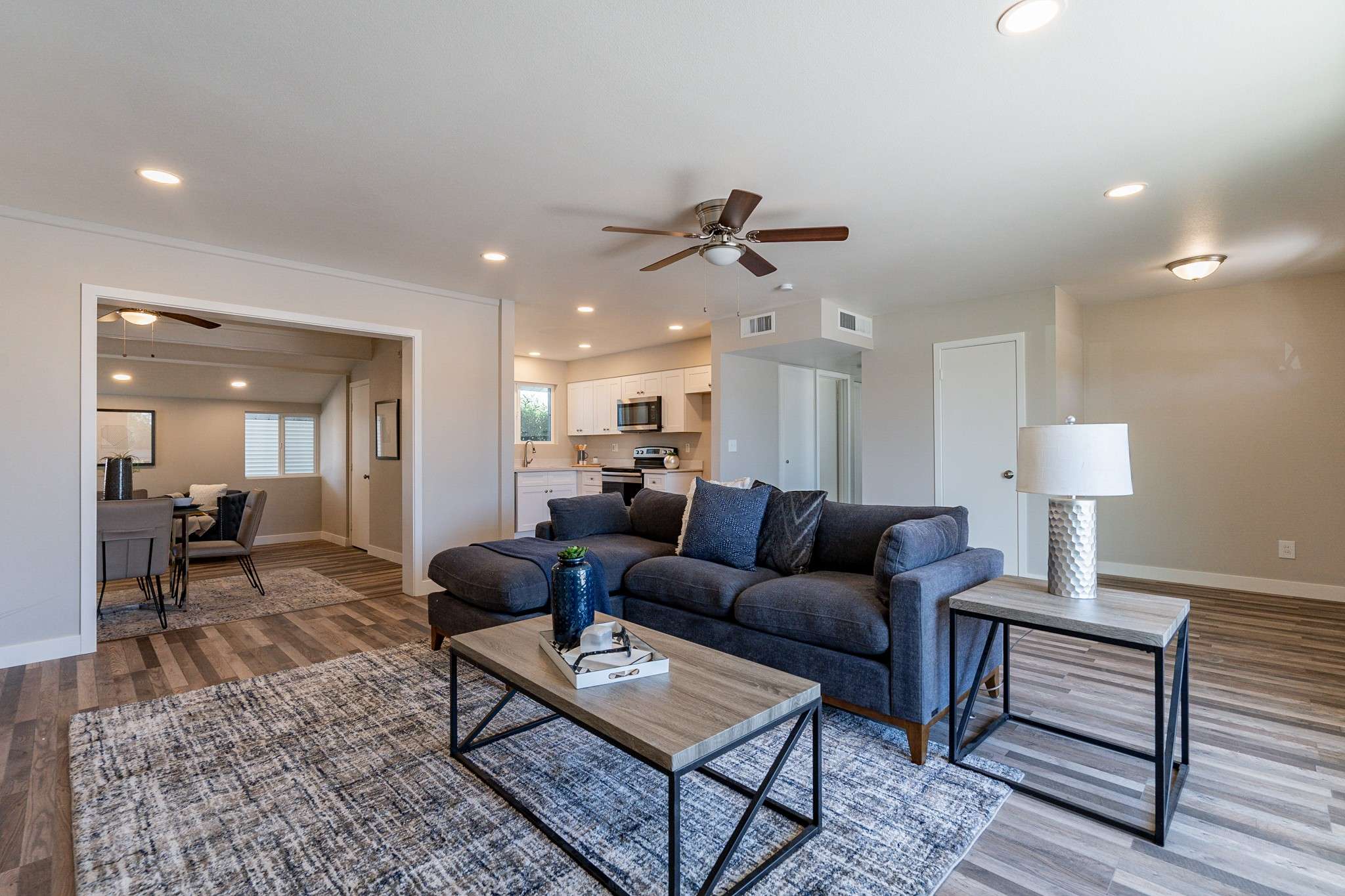 7 of 35. Enjoy abundant natural light in this updated Sun City living room. Featuring modern finishes, dual-pane windows, and an open layout, this home is perfect for relaxation.