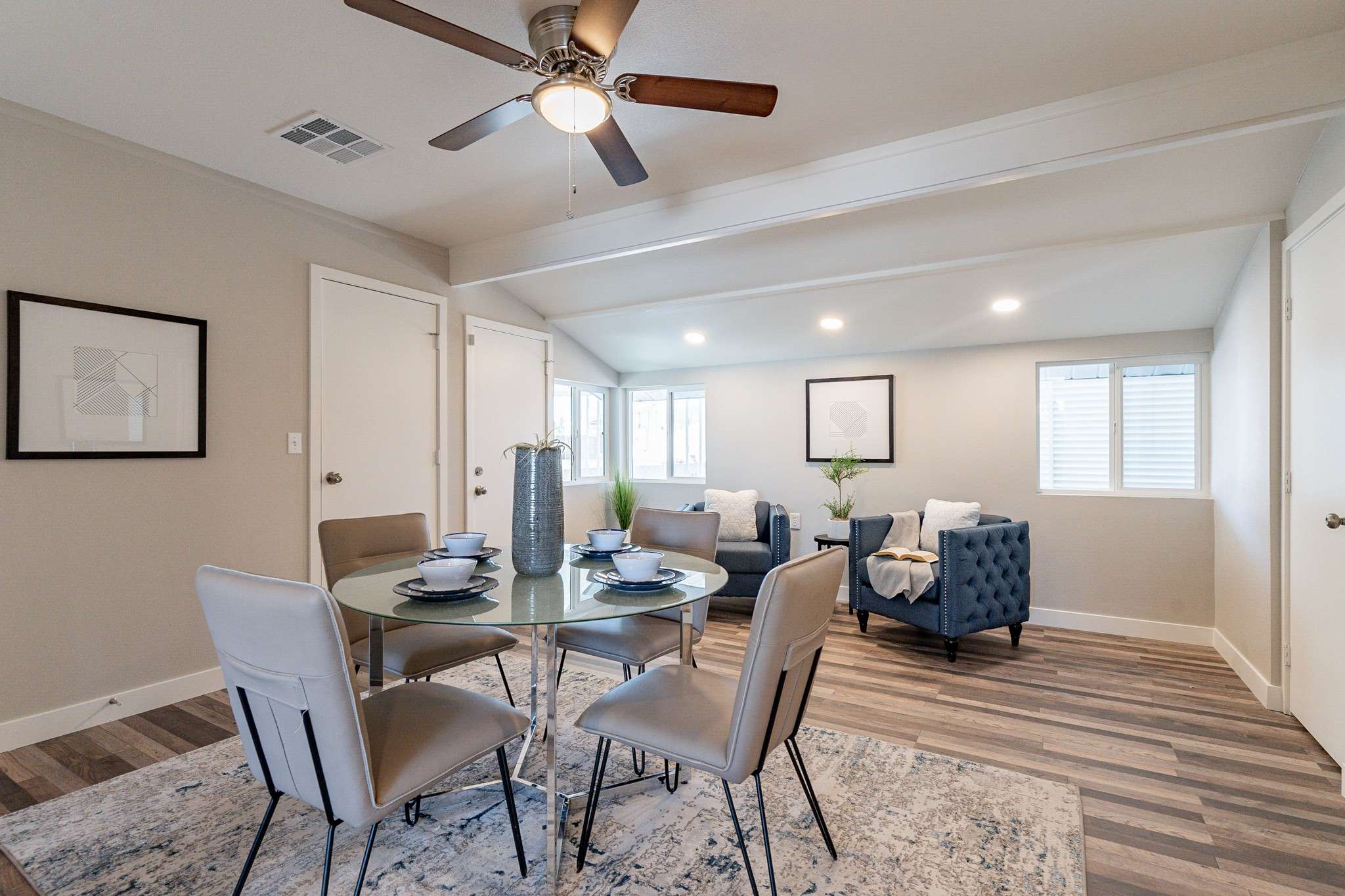 12 of 35. This modern dining space is bright and airy, with plenty of natural light, neutral decor, and stylish finishes. Ideal for intimate dinners or hosting guests.