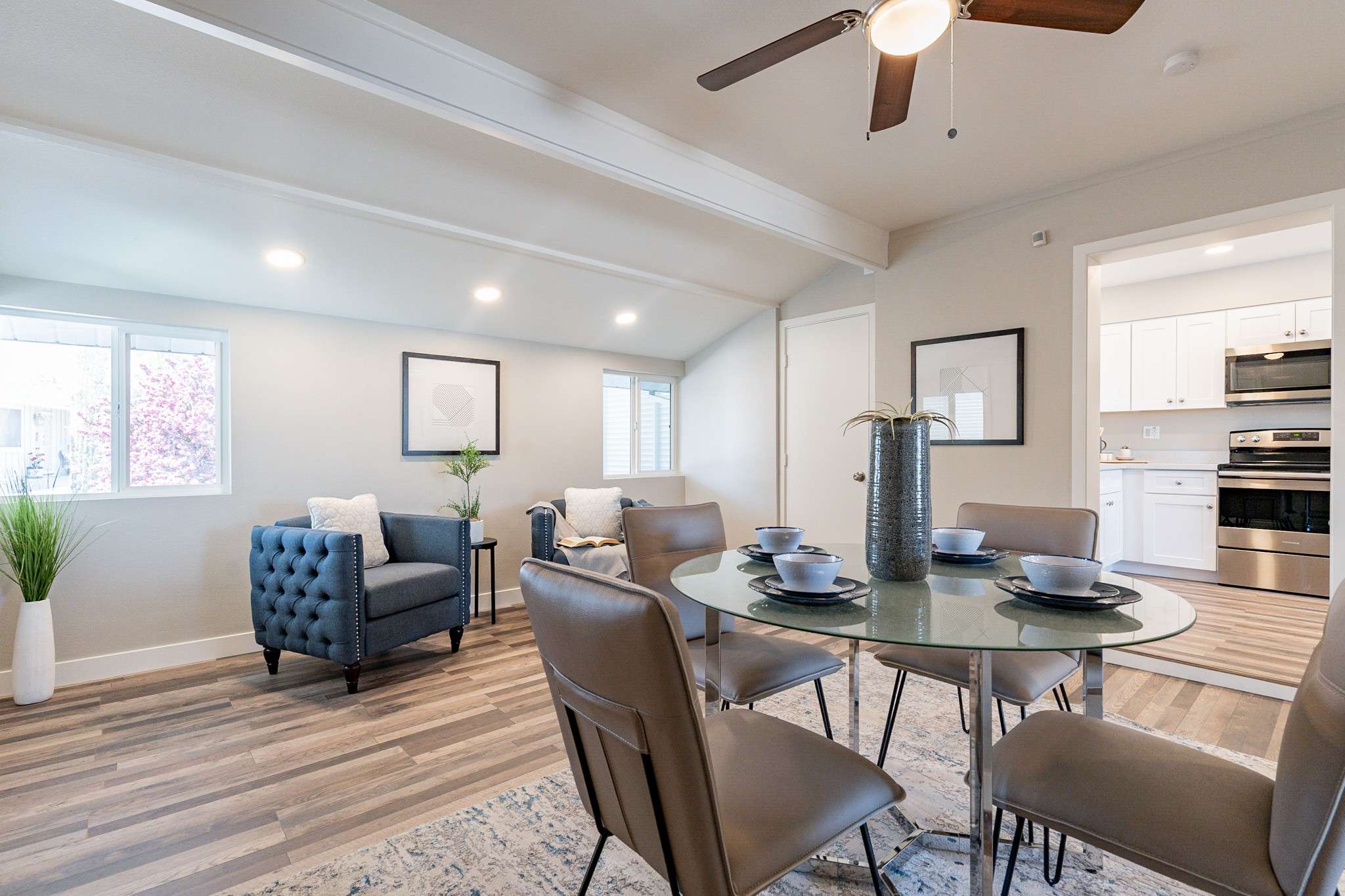 13 of 35. A versatile dining area that doubles as a cozy sitting nook. Featuring recessed lighting, stylish flooring, and ample space, this room is perfect for entertaining or unwinding.