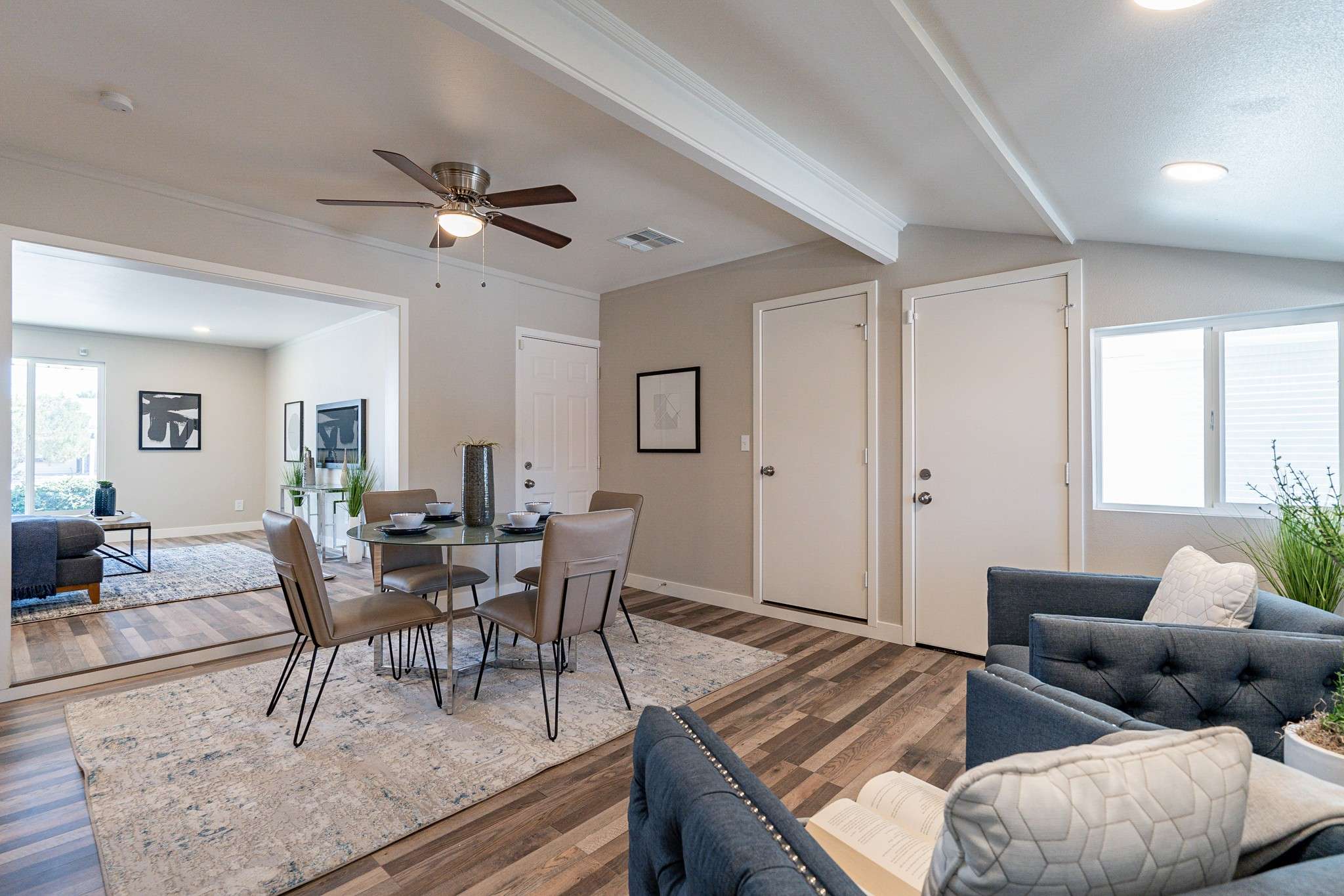 15 of 35. This versatile dining space flows effortlessly into a casual lounge area, offering updated flooring, recessed lighting, and flexible design for modern living.