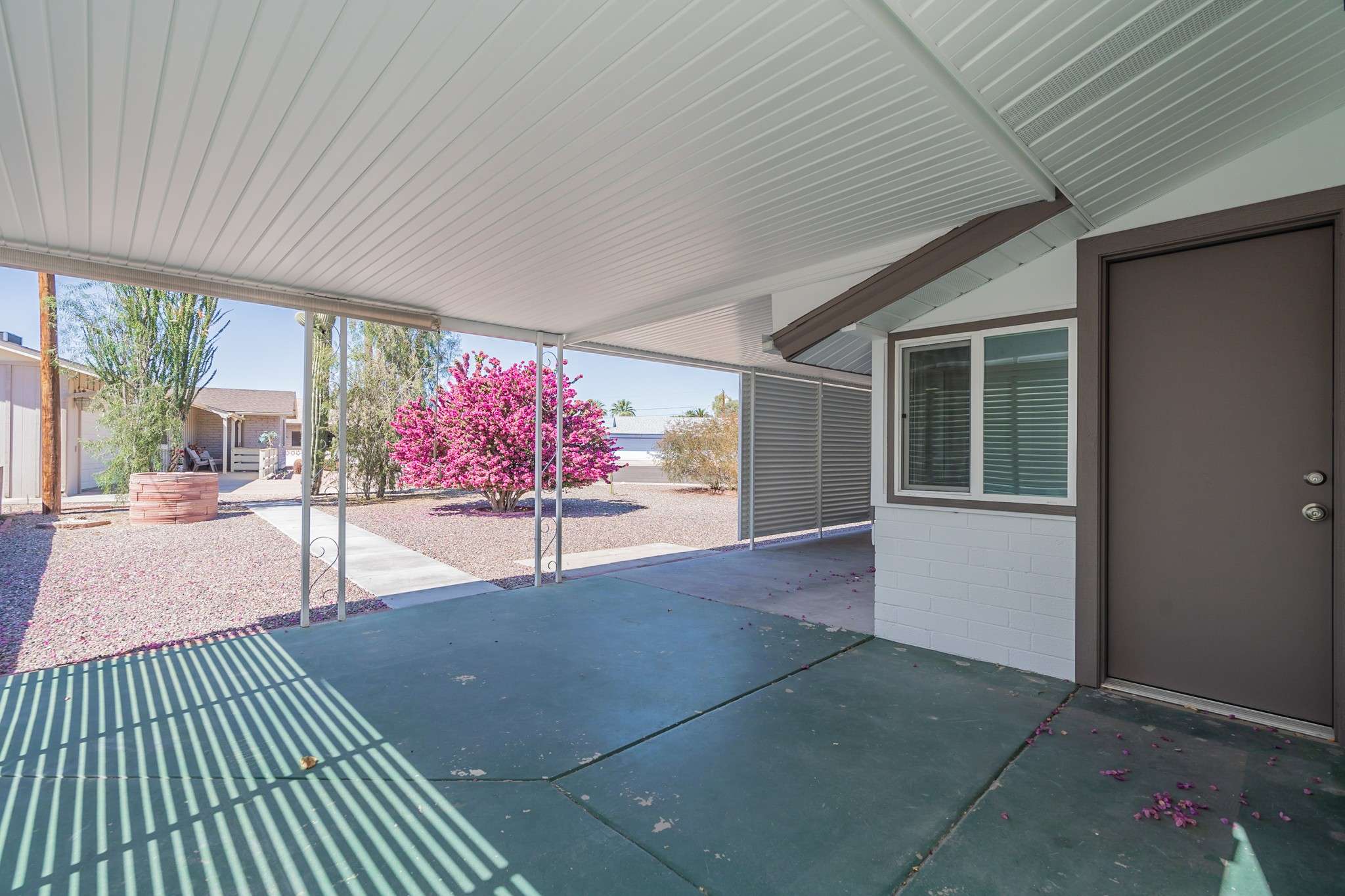 28 of 35. Enjoy year-round outdoor living with this spacious covered patio. Ideal for entertaining or relaxing, this space offers privacy and shade for added comfort.