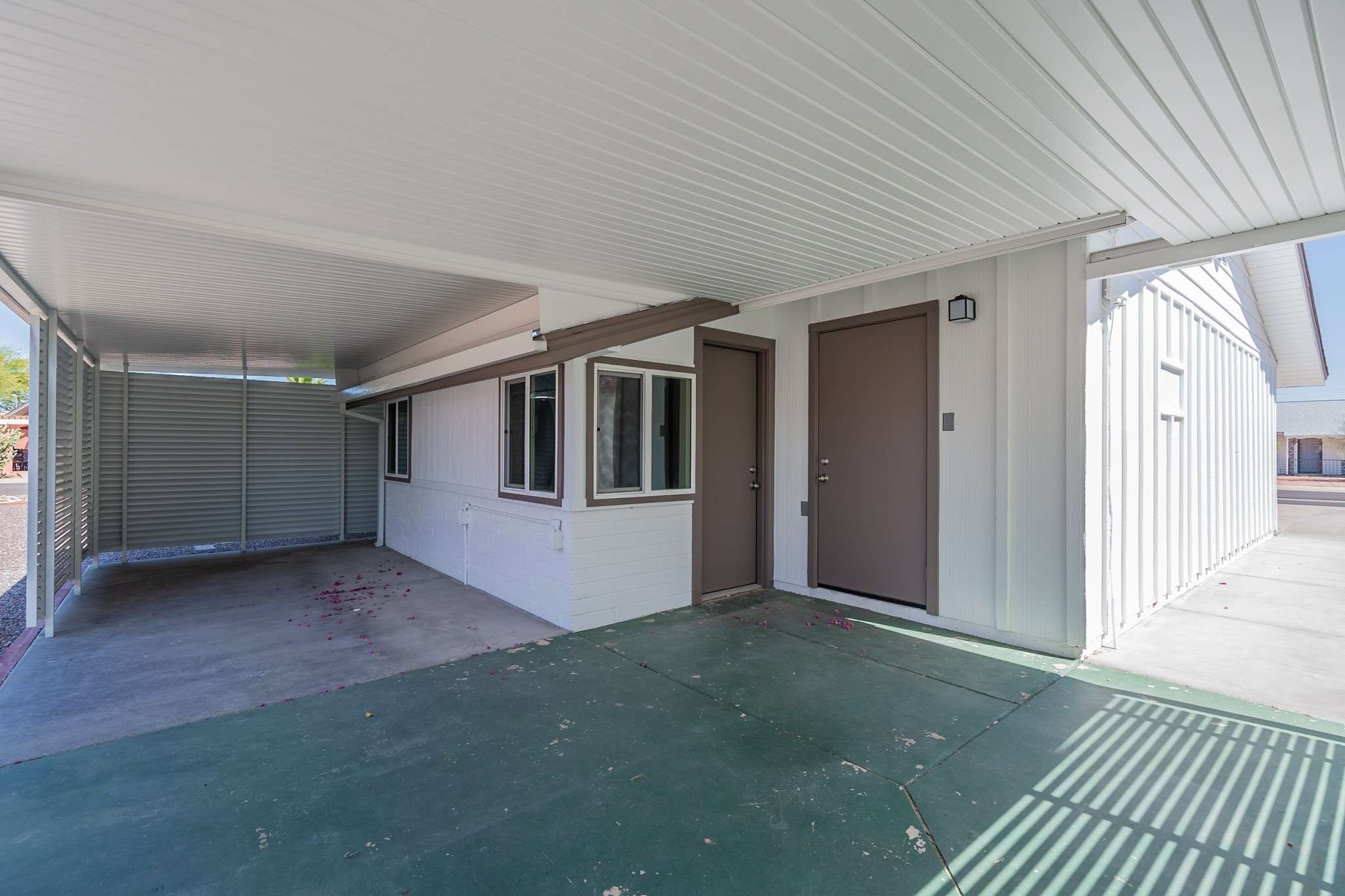 29 of 35. This low-maintenance backyard features a covered patio, mature plants, and a well-maintained gravel landscape. A peaceful retreat in a beautiful setting.
