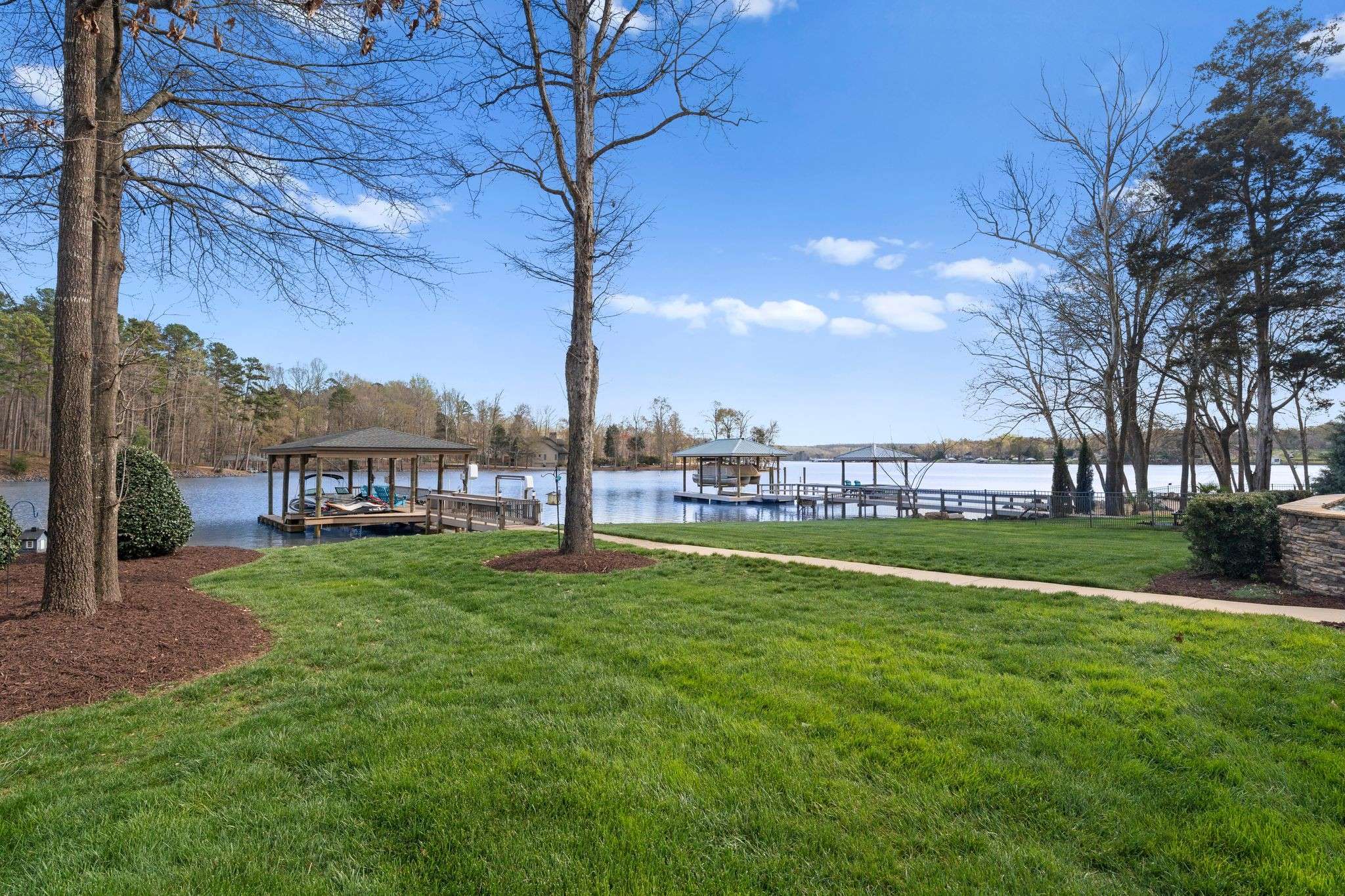 59 of 79. Exterior Day Time Photo - 846 Armstrong Rd - View of Beautifully landscaped flat backyard, with completely unobstructed views of Lake Wylie