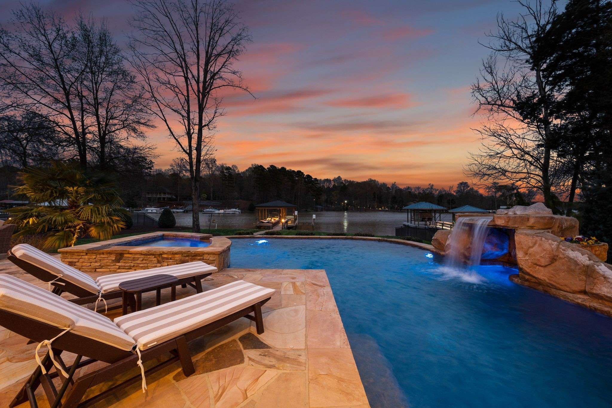 65 of 79. Exterior Twilight Photo - 846 Armstrong Rd - Overlooking Pool and waterfall