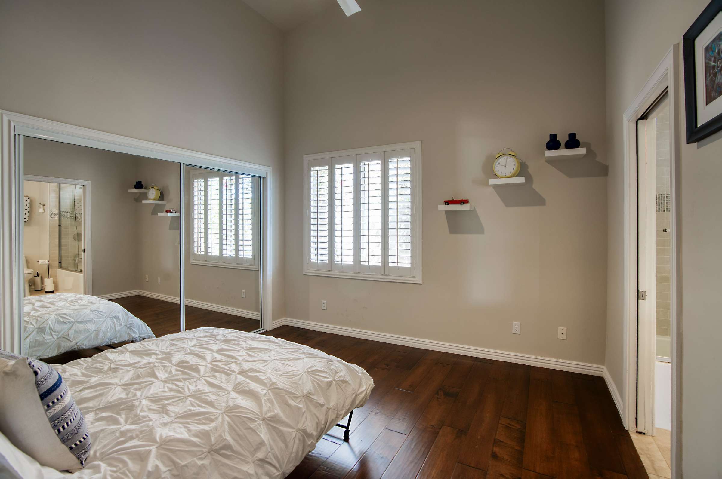 22 of 65. This dual-purpose guest room offers a Murphy bed, built-in California Closets workstation, and natural light perfect for remote work or weekend visitors.