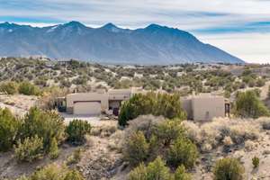 Pueblo style custom on 6+ acres