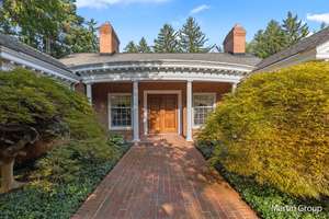 Secluded Luxury in East Grand Rapids: Renovated Ranch Home on Serene 1.8 Acres